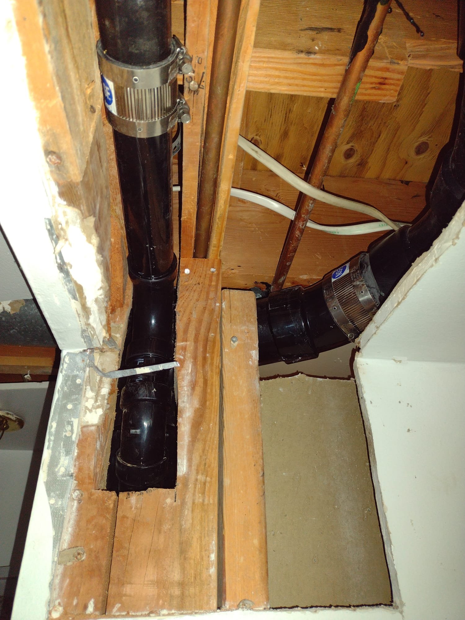 Image showcasing trenchless sewer line replacement: a pristine green lawn above, contrasted with a traditional excavation site, highlighting the minimal disruption and cost-effectiveness of trenchless methods.