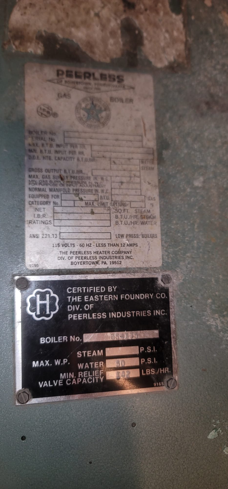 Image of a packaged Buderus boiler system, including the boiler unit and a connected hot water tank. Represents professional boiler service and maintenance for efficient home heating and hot water solutions.