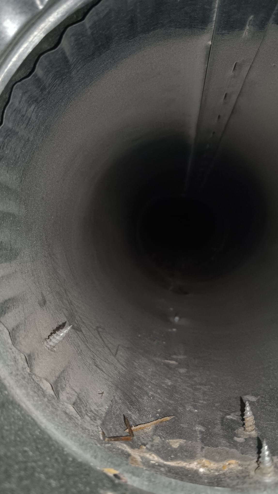 Image of a spotless restaurant kitchen, highlighting a clean grease trap and smoke-free ventilation system, emphasizing the benefits of professional cleaning and maintenance services for fire safety and regulatory compliance.