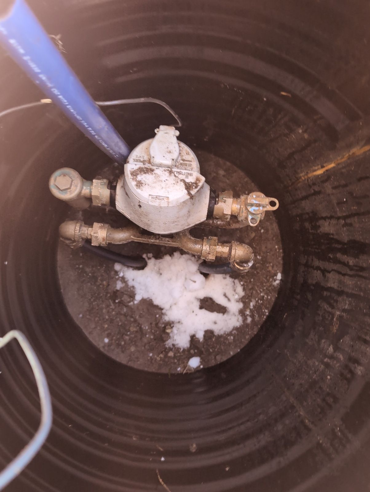 Frustrated homeowner stares at a cold shower head after new water heater install. Call a professional water heater installation company to avoid this! See our how-to guide for proper water heater installation.