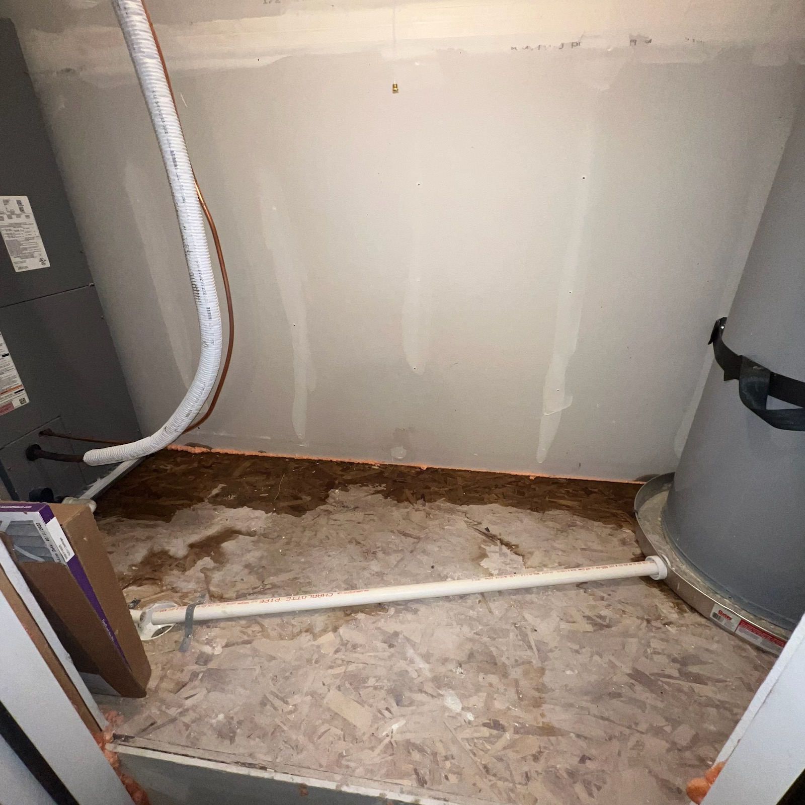 Image of a clear glass of water next to a whole house water filtration system and a water softener, contrasted with a dark, murky glass of water. A rain cloud icon is subtly placed above the filtration system. Text overlay: "Clean Water, Rain or Shine. Calcium Removal Available."