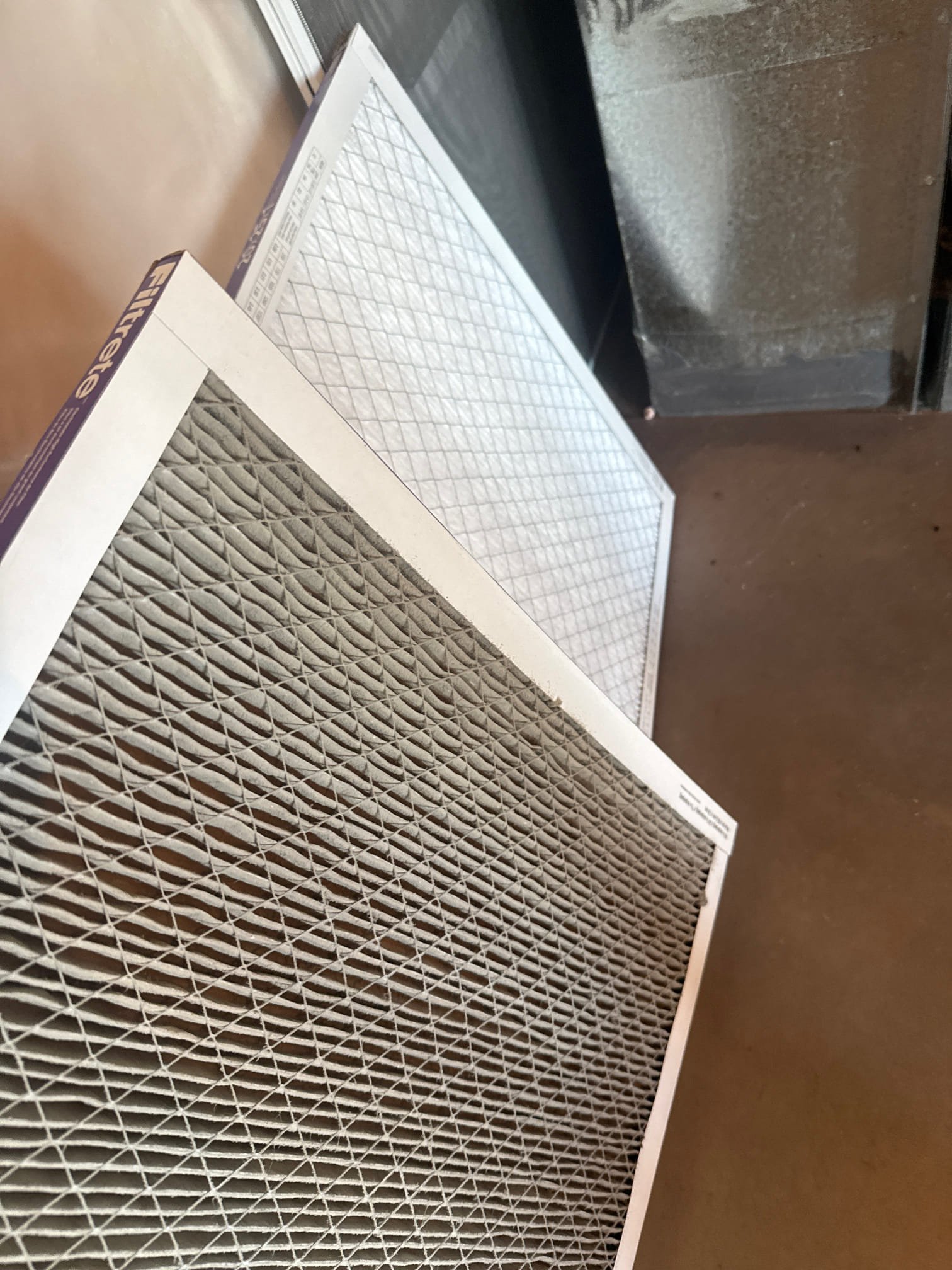 A modern home interior showcases the seamless integration of a central air conditioning unit, highlighting its sleek design and quiet operation. Vents are discreetly placed, ensuring even cooling throughout the space. The image suggests energy efficiency and improved air quality, emphasizing the benefits of professional central air conditioning installation.