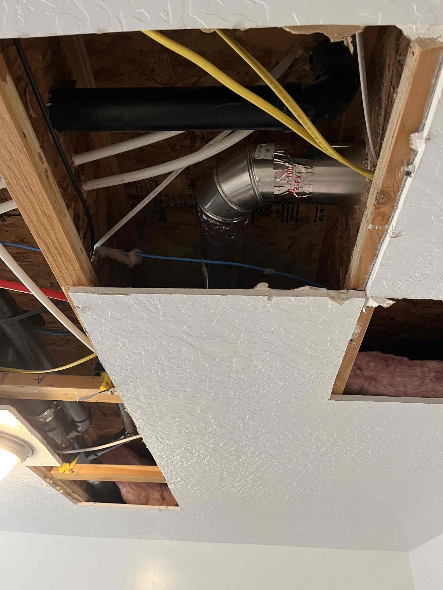 A split image: On the left, a worried homeowner stands in front of an older home with visible plumbing issues. On the right, a smiling plumber efficiently clears a drain with modern equipment. The contrast highlights affordable, effective drain solutions for older houses.