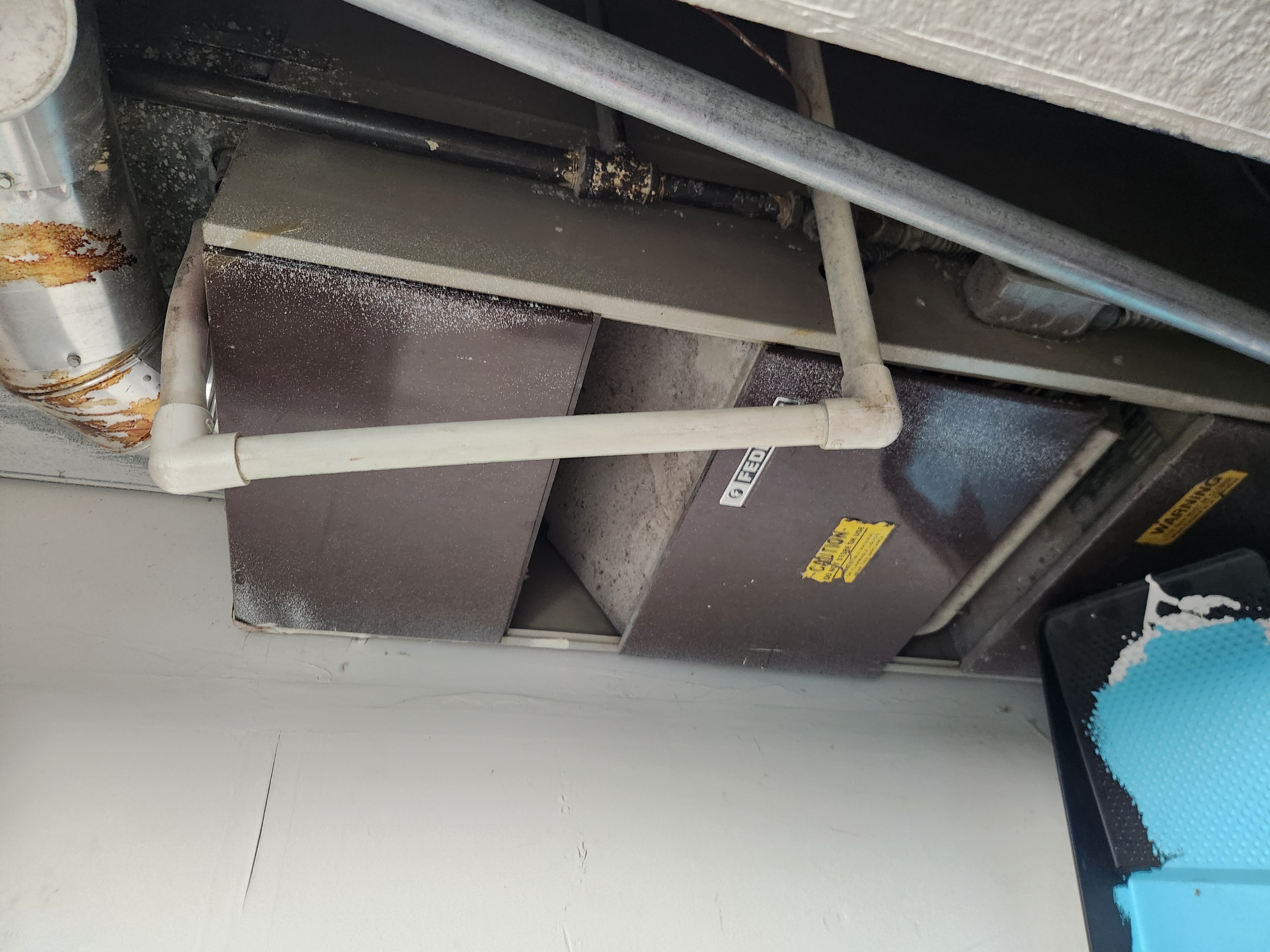 Image of a Bountiful, Utah home's gas furnace being inspected by a local HVAC technician. Ensuring safe and efficient operation for residents. Related to residential furnace repair near me and trusted residential HVAC installers in the Bountiful area.
