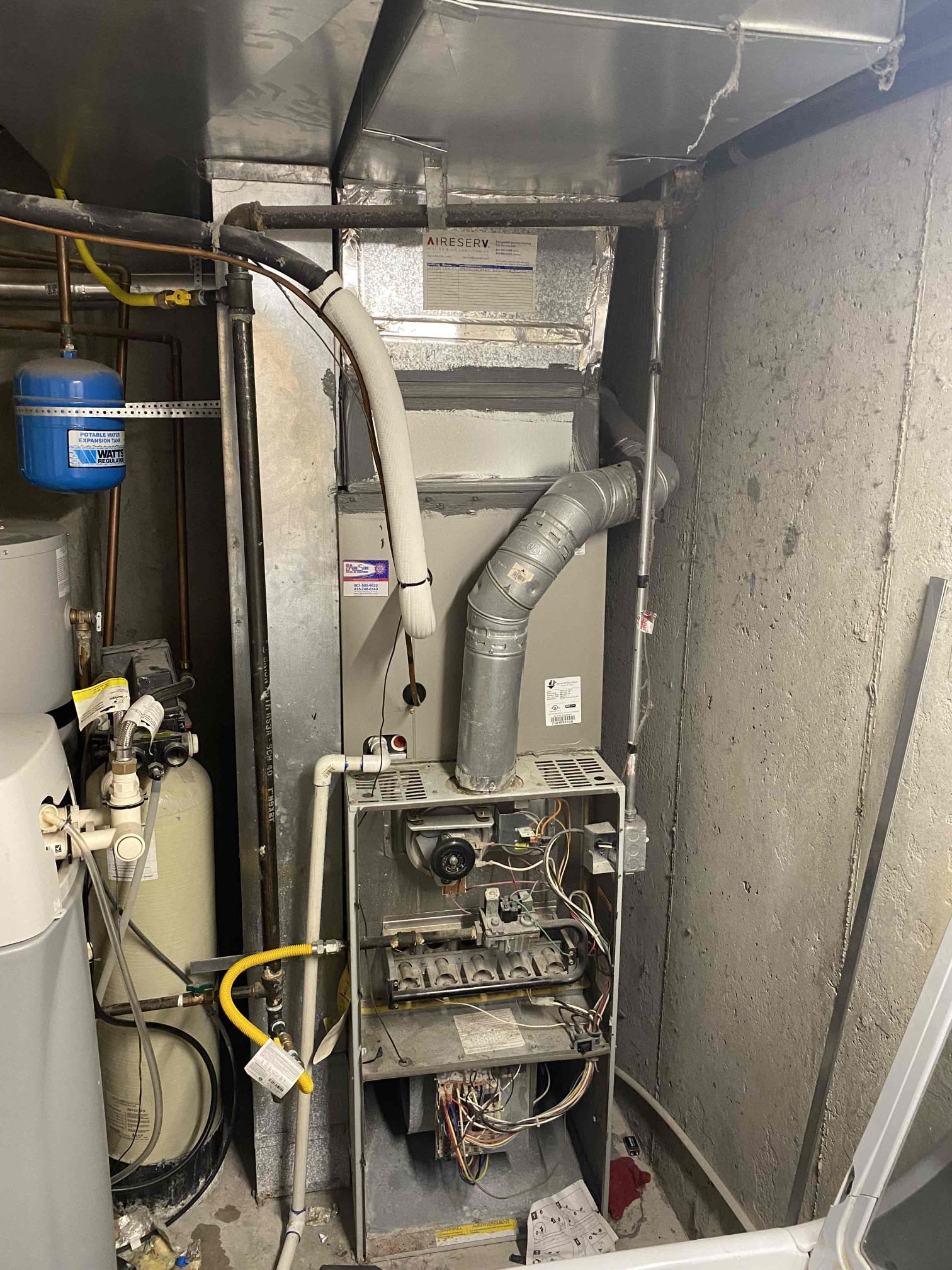 New, efficient furnace being installed. Clean, modern design suggests energy savings and quiet operation. Professional installation ensures optimal performance for both heating and cooling systems.