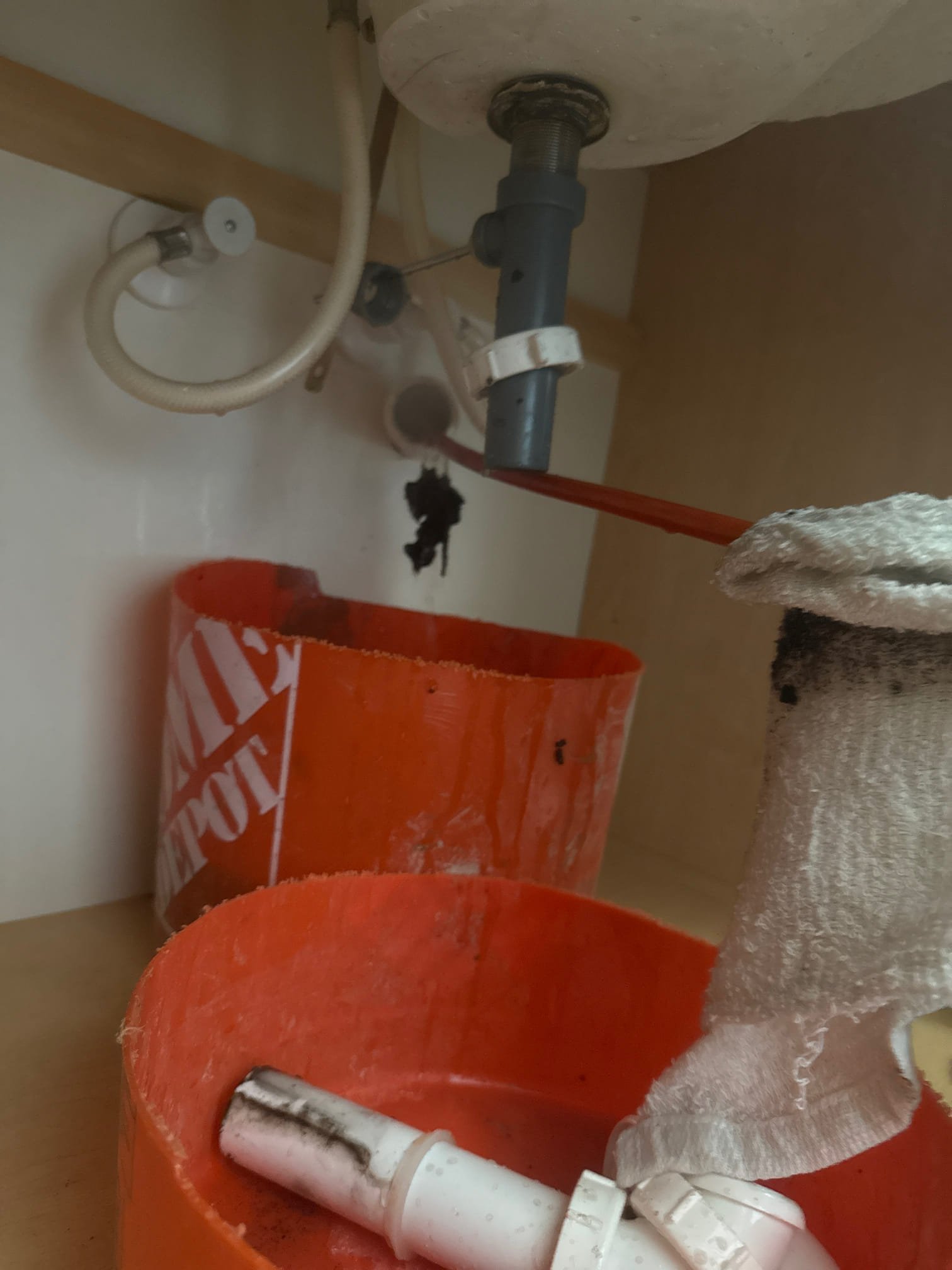 Image shows a home interior after sewage backup. An air purifier with a cleanable filter is prominently displayed, symbolizing air quality improvement. A checklist titled 'Residential Sewage Backup Cleanup Inspection' lies nearby, suggesting a thorough cleanup process.