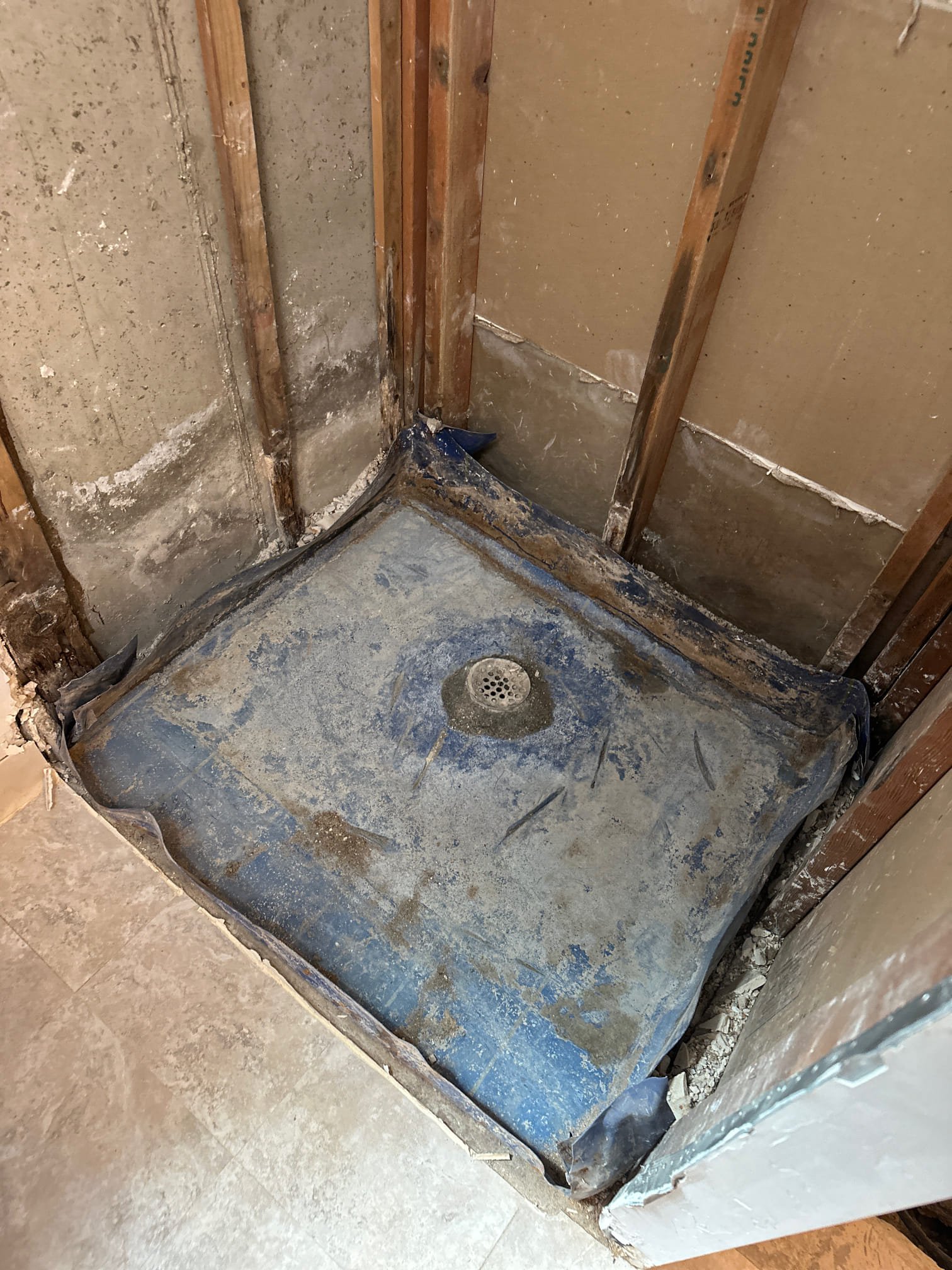 Fast water extraction in a flooded basement. Visible water being pumped out, showcasing quick response. Cleaned and sanitized area highlighting the benefit of same-day service and emergency flood recovery.