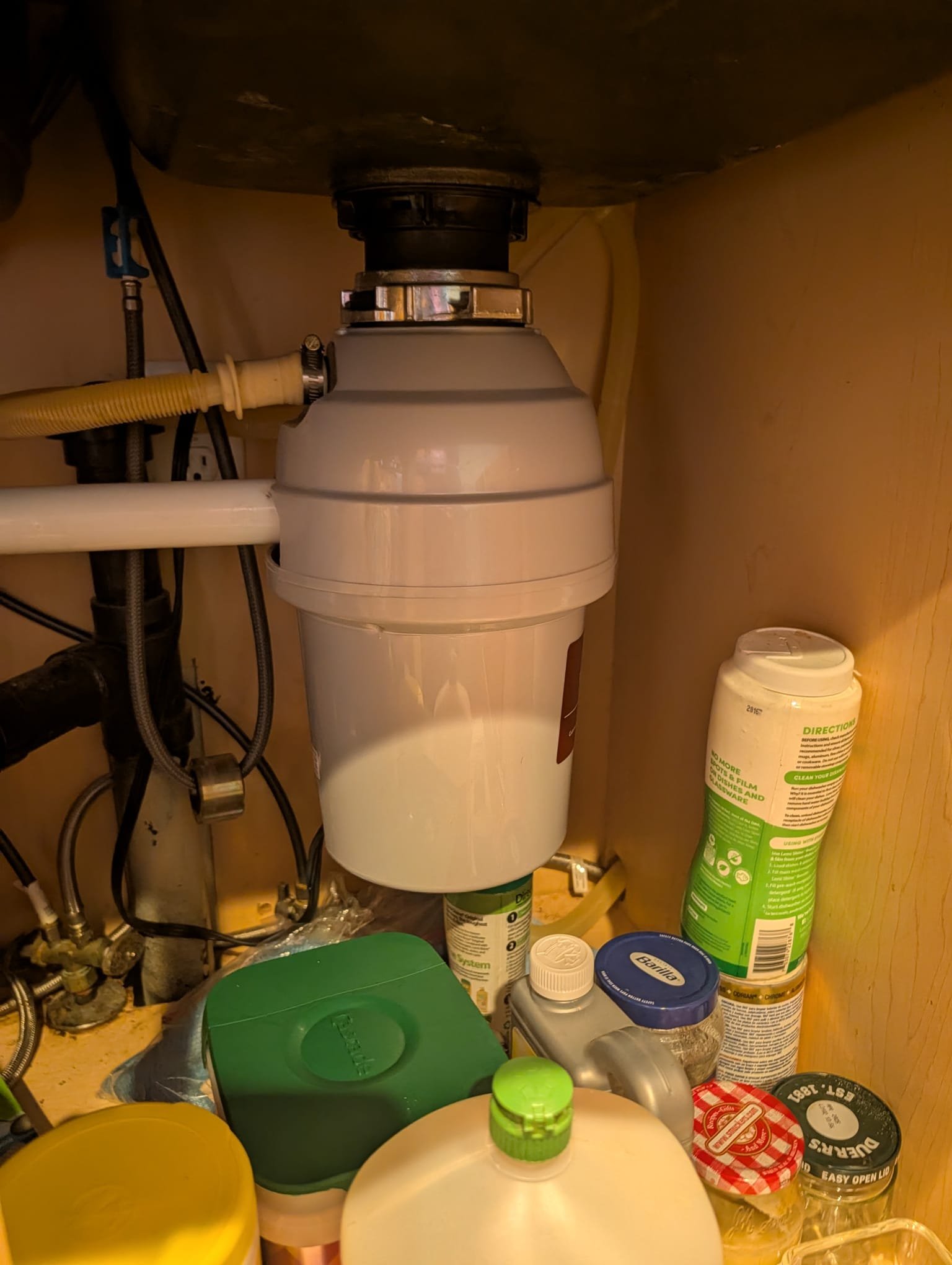 A powerful plumbing snake effortlessly clears a clogged drain, hinting at the benefits of a plumbing smoke test machine rental for identifying hidden leaks and a pipe finder for precise problem location.