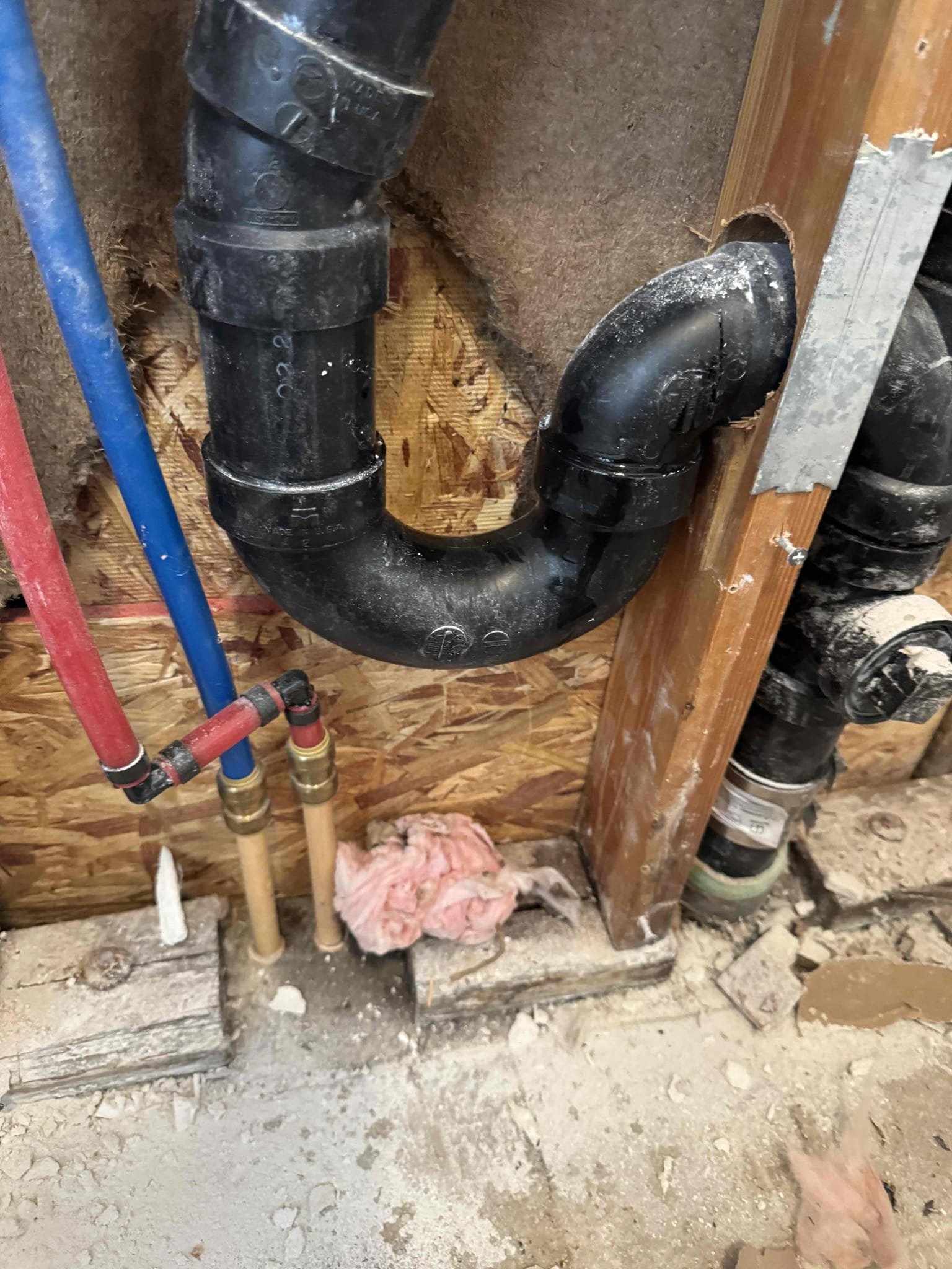 Image of a sparkling clean commercial space after sewage backup restoration. Technicians in protective gear conduct backflow testing, ensuring water safety. Text overlay: 'Same-Day Sewage Backup Restoration: Protecting Your Business.'