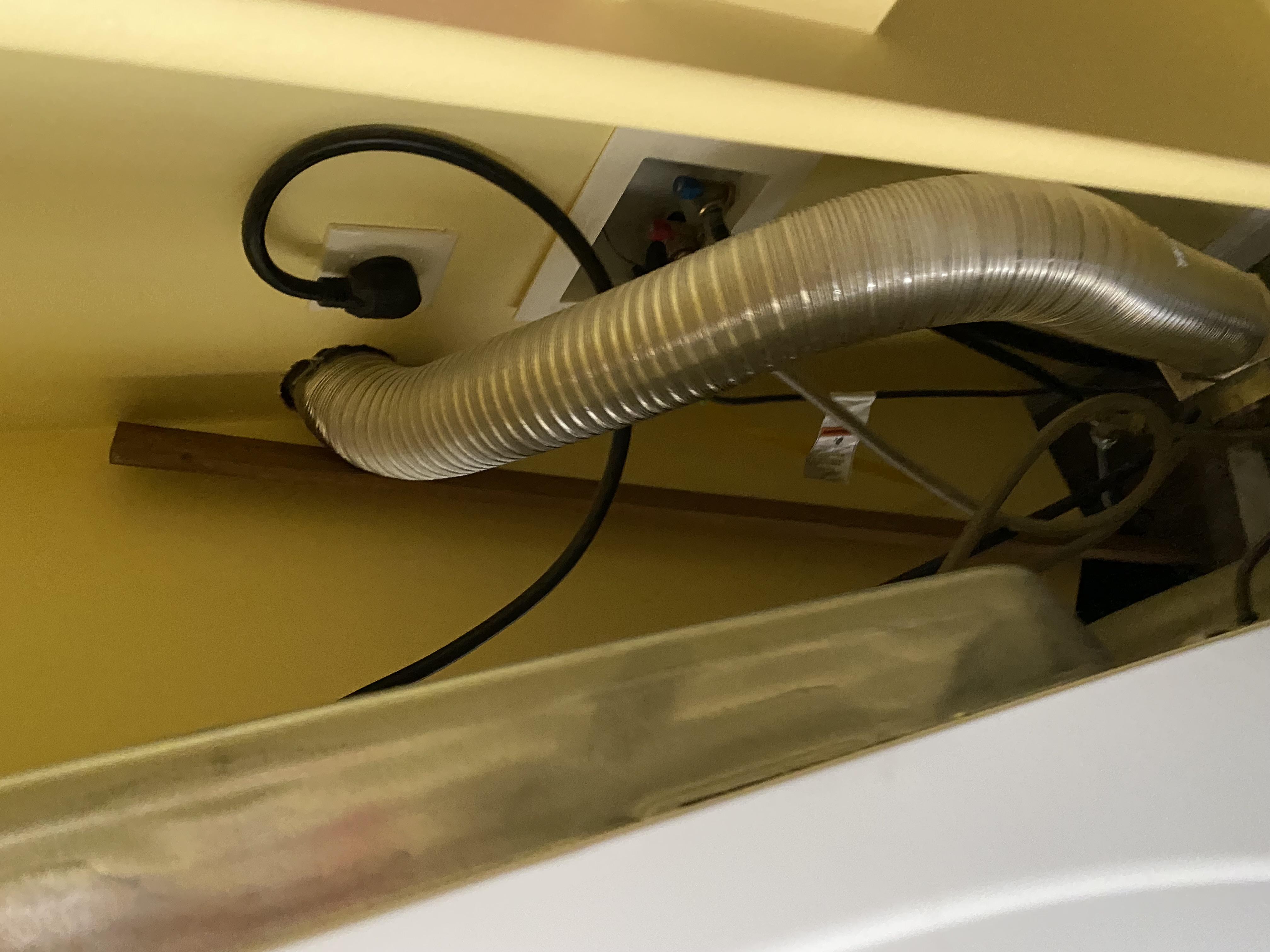 Aftermath of a clogged disposal sink, now sparkling clean. Before-and-after shot showcasing disaster cleaning repair, highlighting a pristine sink and organized space, demonstrating the effectiveness of a home deep cleaner.