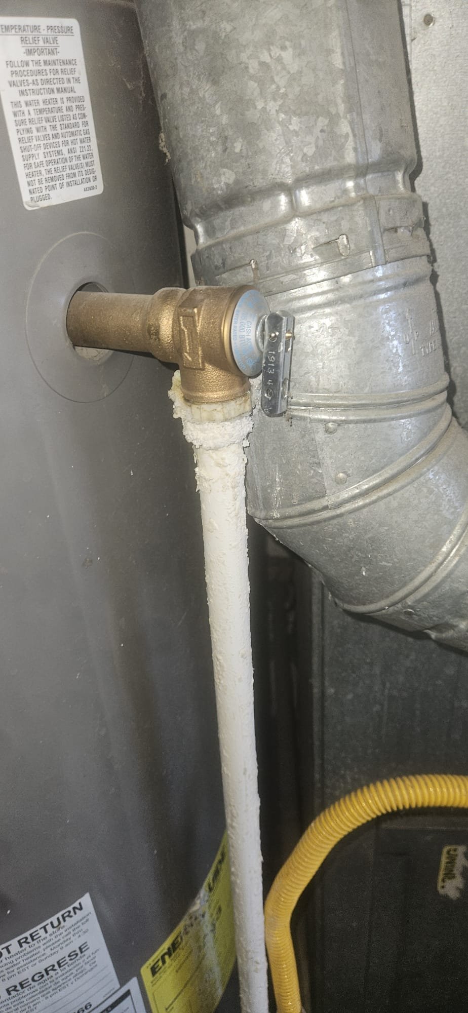 Residential home with visible fire damage being cleaned up. Restoration crew is actively removing debris, highlighting the benefit of same-day and 24-hour cleanup services for quick recovery and maintenance.