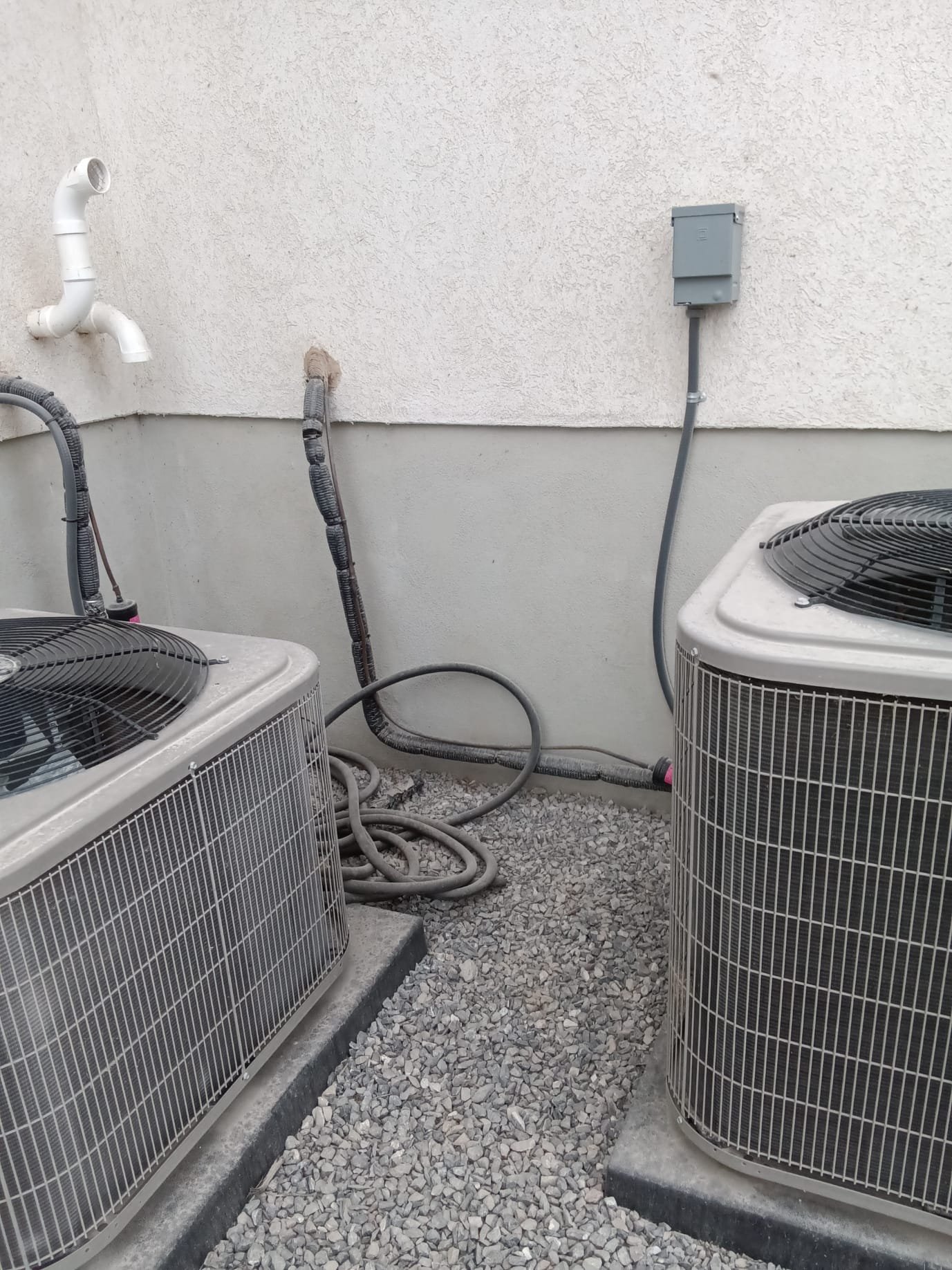 A row of newly installed cast iron radiators gleams against a freshly painted wall, showcasing their efficient heat distribution and classic design. The image suggests a cost-effective and durable heating solution, relevant for those considering cast iron radiators for sale or disaster remediation pricing.