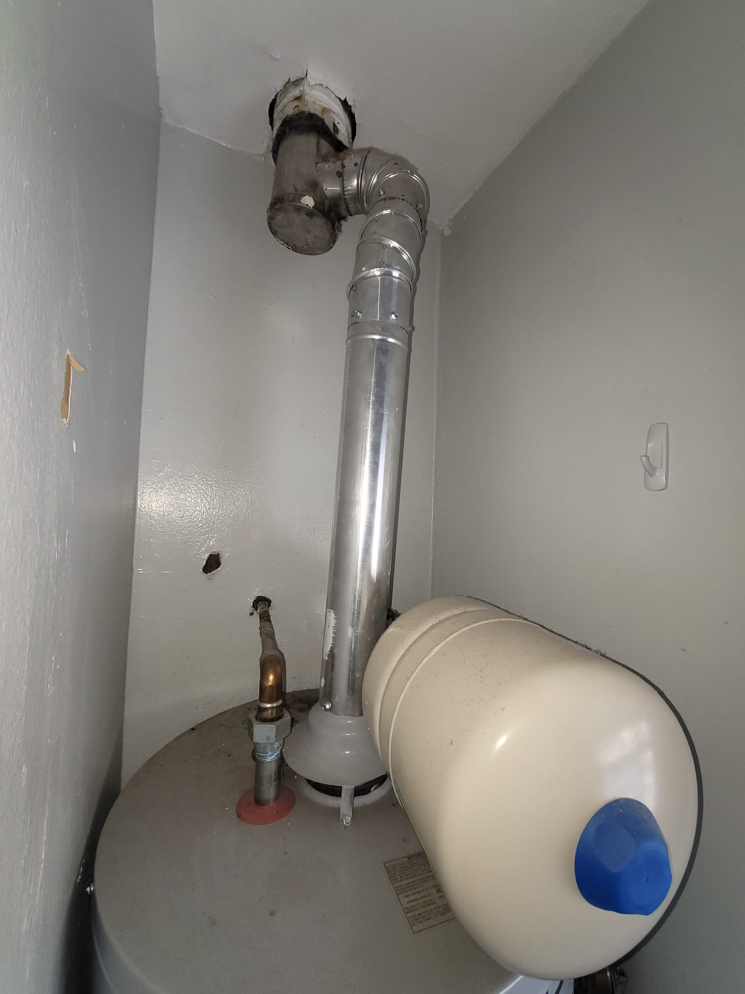 A sunlit home interior with open windows, plants thriving, and a faint, dissipating smoky haze. The image suggests fresh air replacing lingering odors, subtly highlighting the benefits of ventilation after light smoke damage and minimizing potential health risks associated with lingering smells.