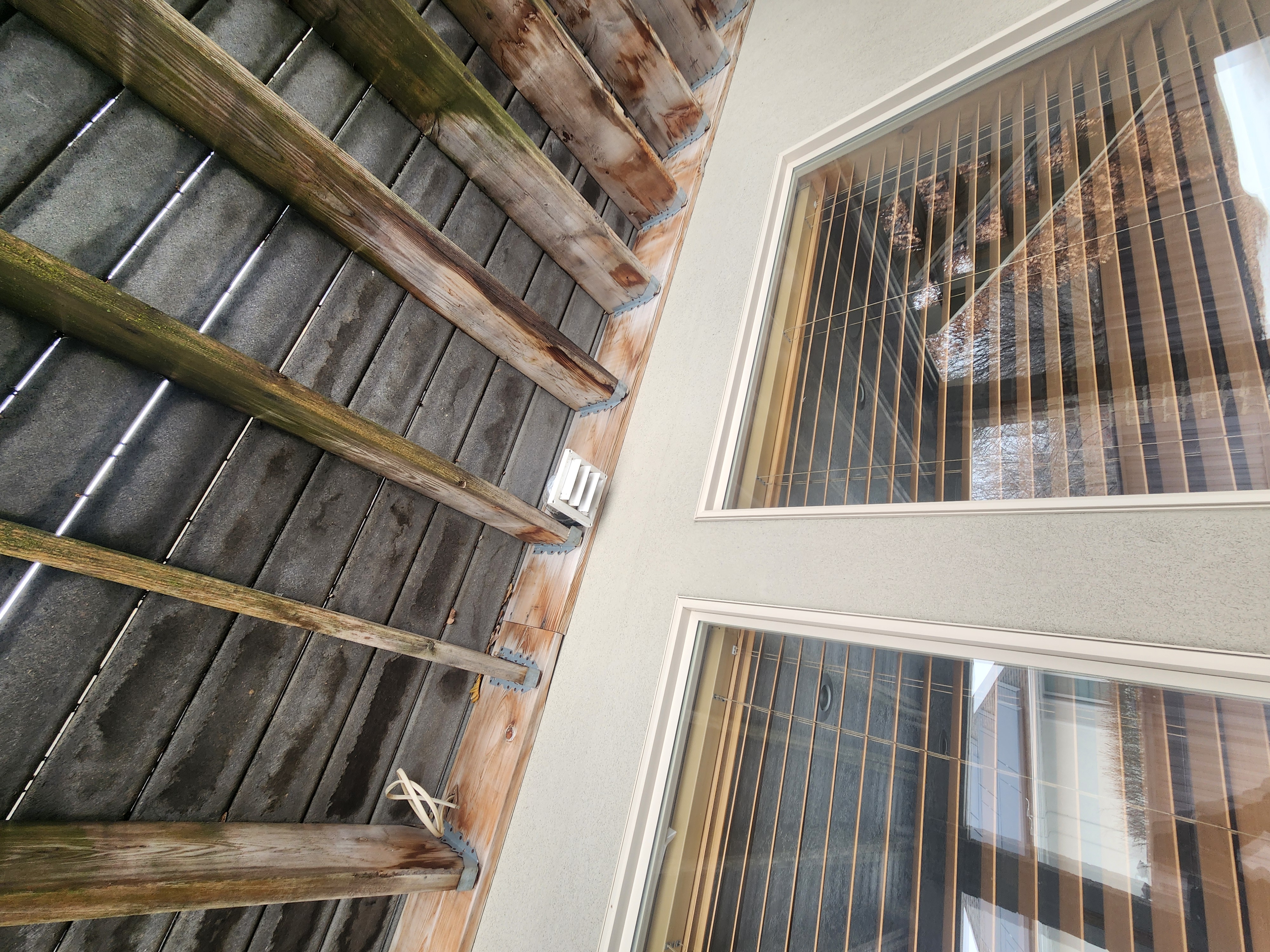 Clean dryer vent shown with before-and-after comparison, highlighting improved airflow and reduced lint buildup. In the background, a subtly depicted smoke filter ensures a smoke-free kitchen, suggesting overall home air quality improvement. Implies reduced fire risk and cleaner air, connecting to residential smoke cleaning benefits.