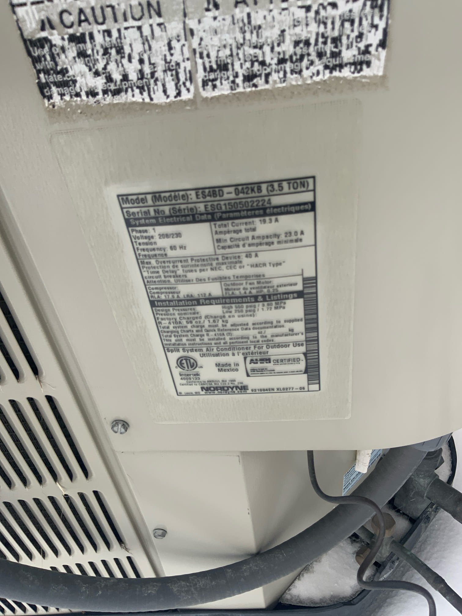 Clean, bright home interior after smoke restoration. Air purifier visibly emitting clean air. Text overlay: "Breathe Easier: Licensed Smoke Restoration & Air Purifiers for a Fresh Start."