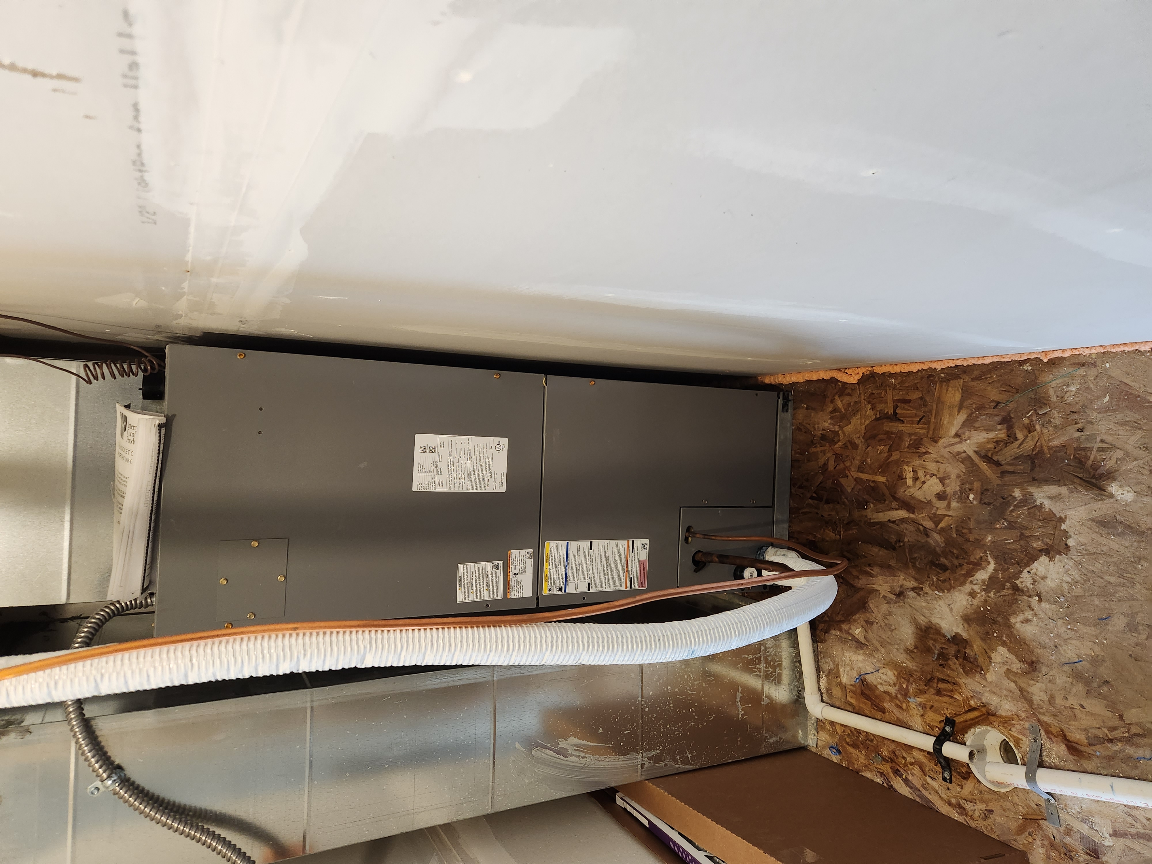 Clean, bright basement after drywall repair and odor removal, emphasizing fresh air and undamaged walls. A sleek water filter is subtly visible, symbolizing pure water and preventing future hard water damage that could lead to similar basement issues. Illustrates the benefit of maintenance and clean water for a healthy home.