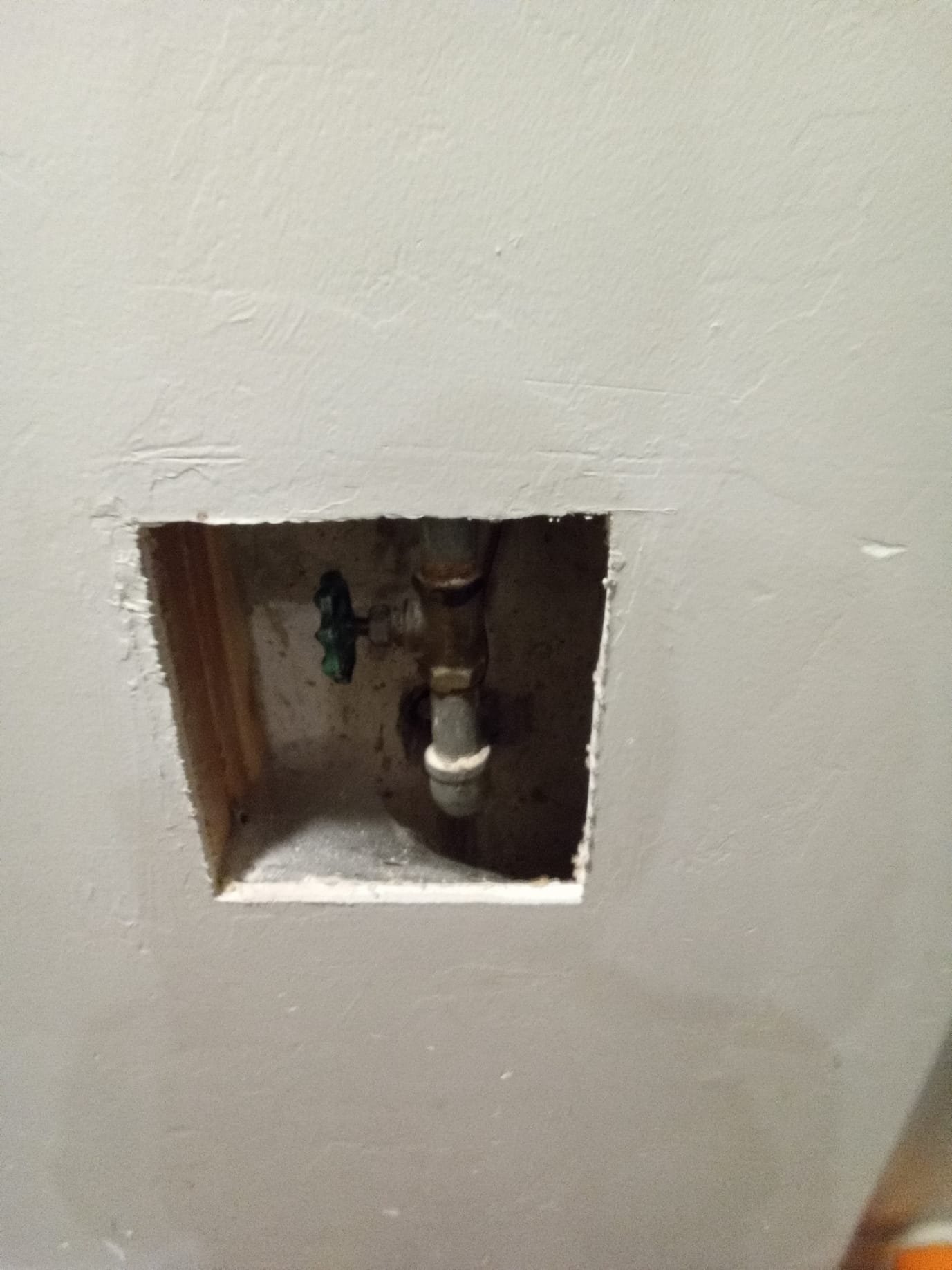 Clean, bright basement with newly installed sewage backup system; before-and-after showcasing emergency recovery highlighting a dry, safe, and restored space.