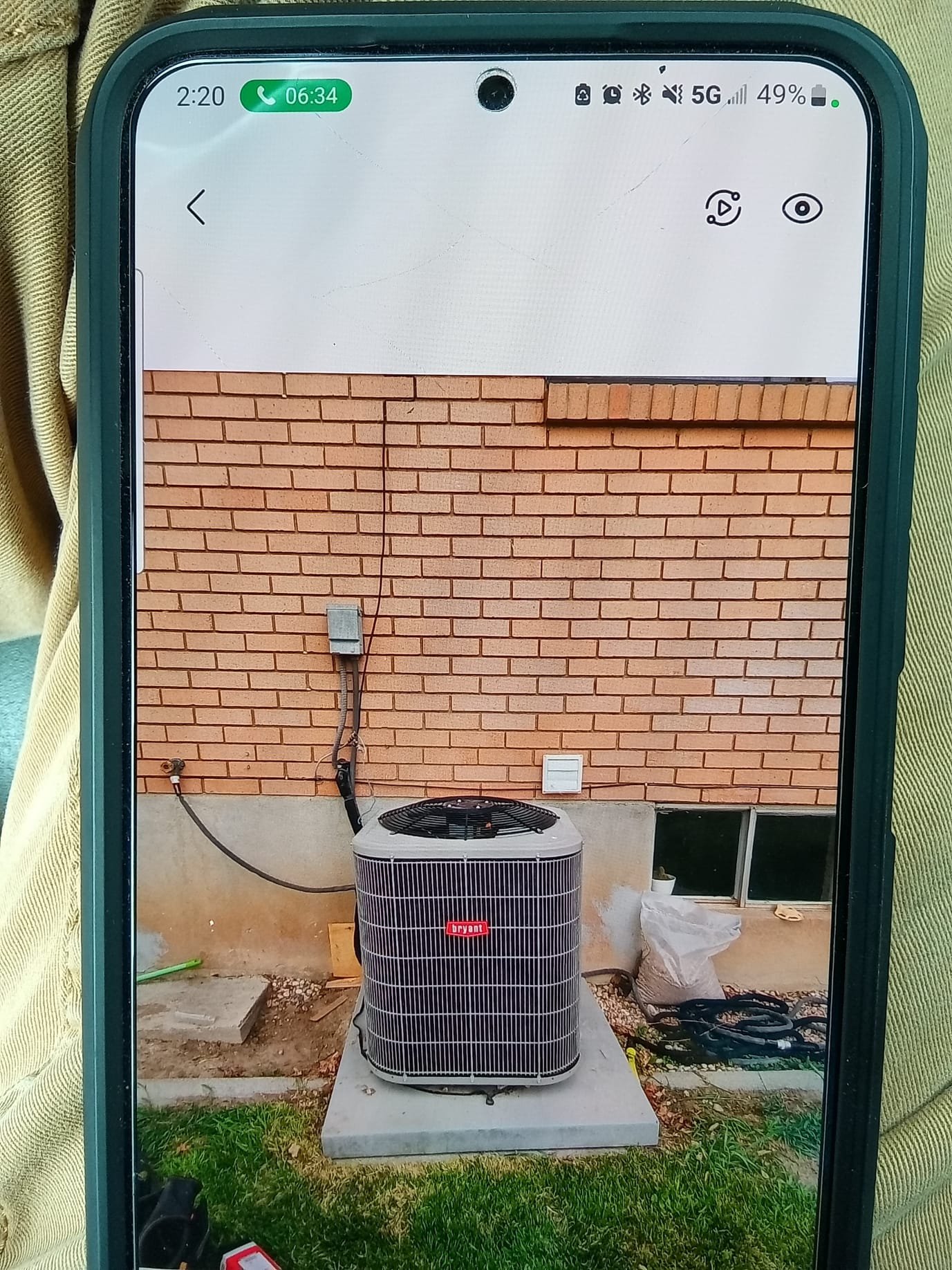 A person wearing a personal air purifier, breathing clean air, while in the background a residential HVAC system is being replaced, and a mobile home air conditioner is visible, suggesting improved indoor air quality for various living spaces.
