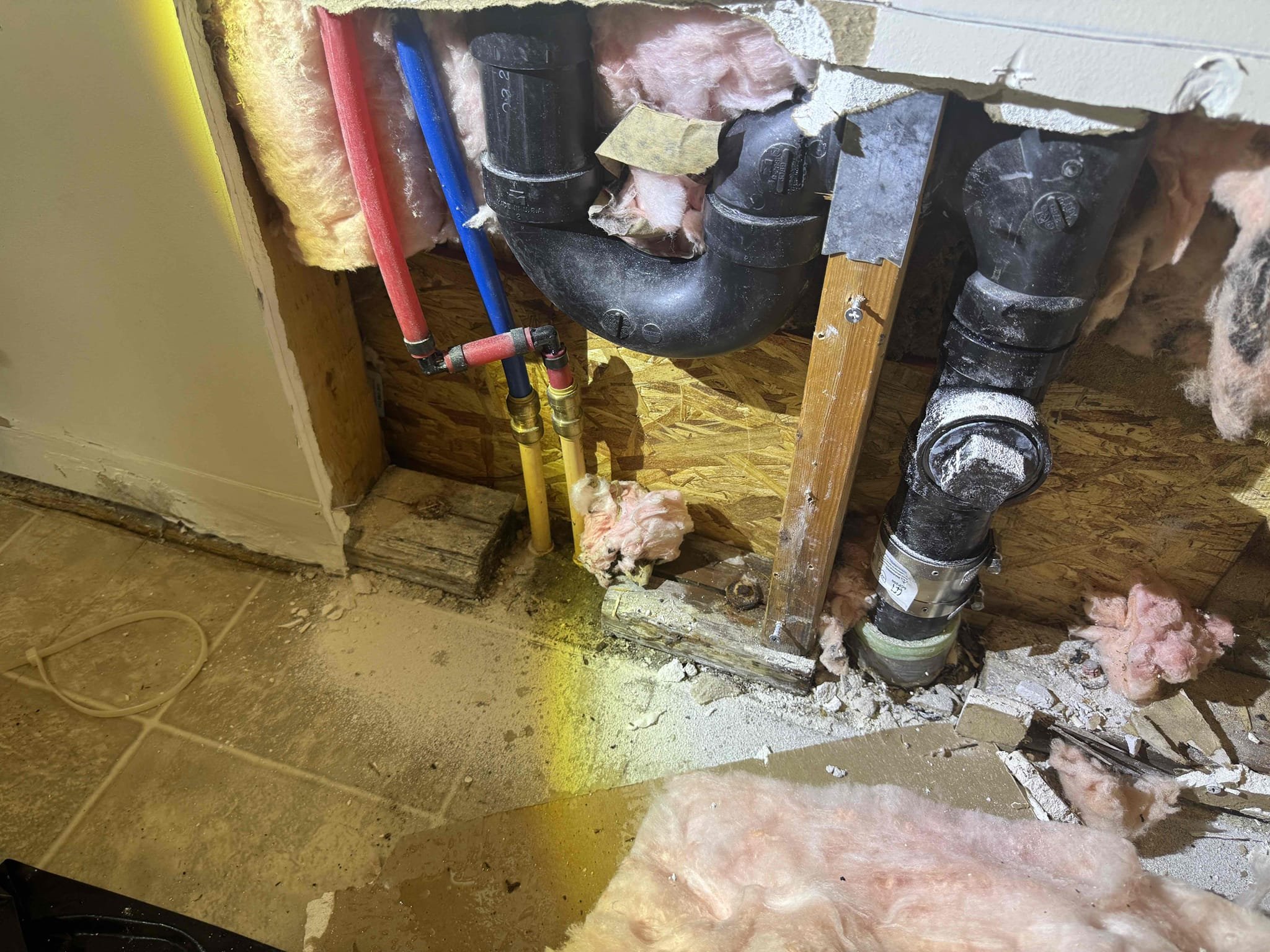 Image depicts a clean, restored commercial space following sewage backup restoration. Visible are gleaming floors and sanitized equipment, highlighting the benefits of prompt 24-hour service and thorough backflow testing to prevent future incidents.