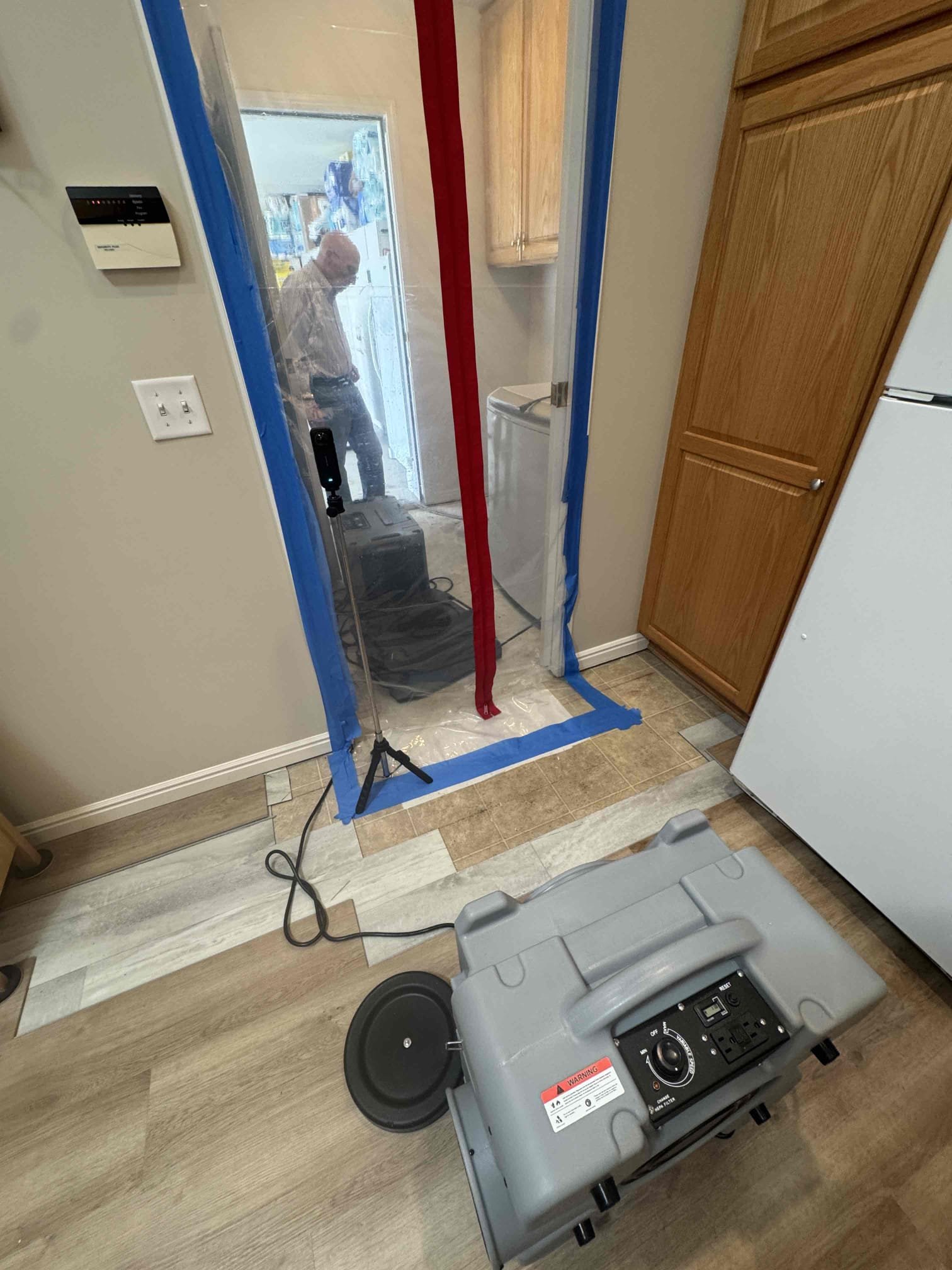 Clean, organized commercial space after sewage backup restoration, highlighting preventative backflow testing equipment. Emphasizes cost-effectiveness through displayed 'Before & After' comparison showcasing damage mitigation and minimized business disruption.