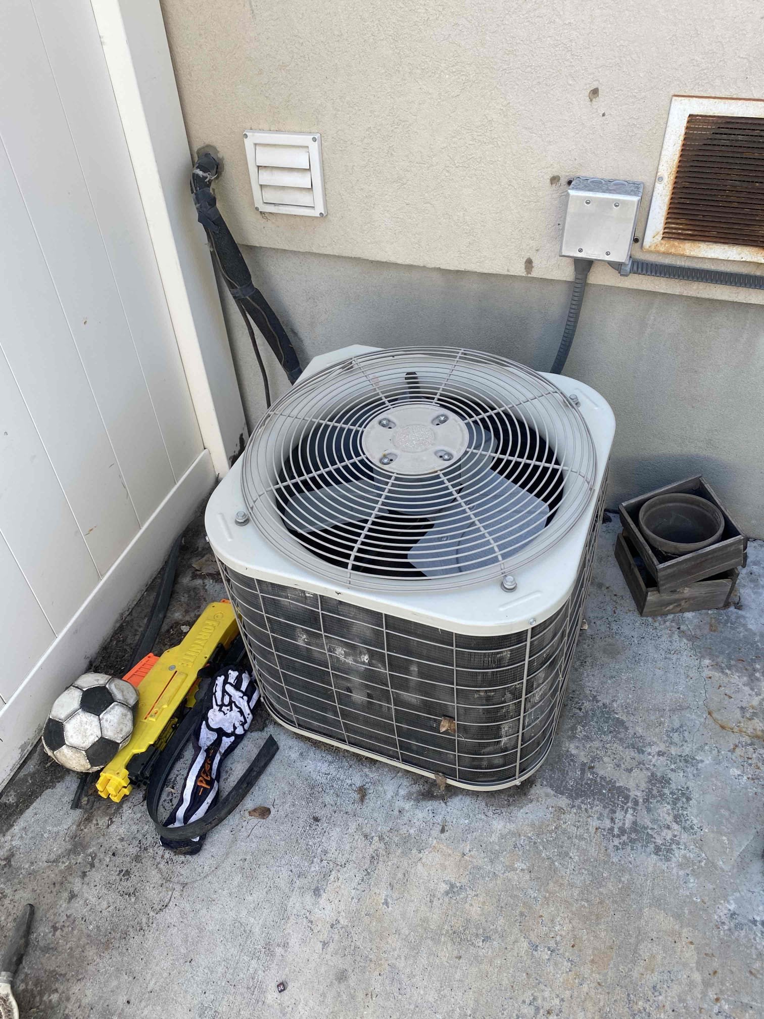 A quiet mobile air conditioner stands in a brightly lit office, suggesting clean air. Its sleek design implies efficient commercial air purification, while its portability hints at easy maintenance and accessibility for commercial air conditioning tune-ups and repairs.