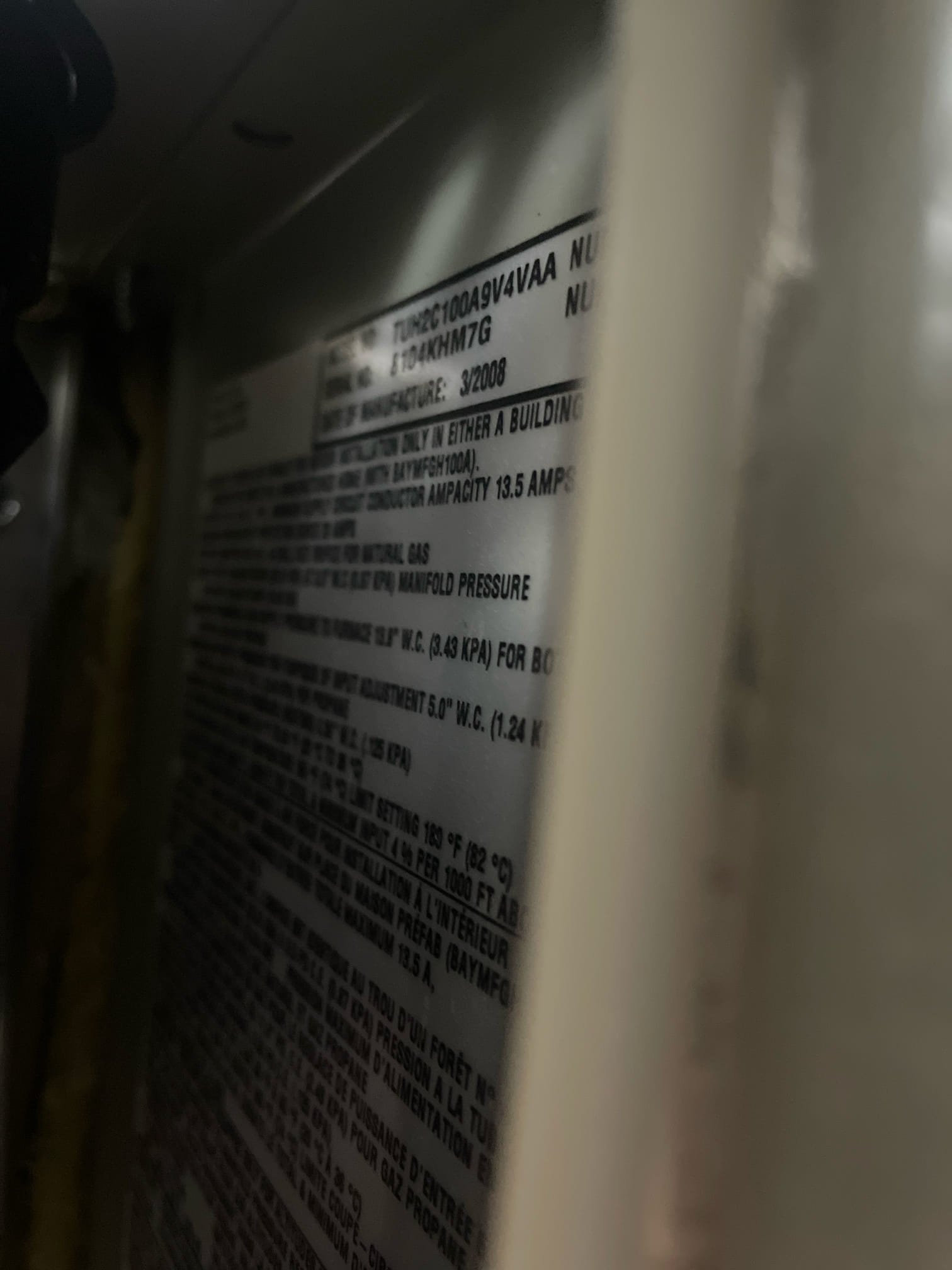 A sleek, modern portable air conditioner and heating unit stands in a comfortably furnished living room, implying easy temperature control. A soft, warm glow emanates from the unit's display, suggesting efficient heating. The unit's compact design emphasizes its portability and space-saving benefits, hinting at professional residential heating tune-ups for optimal performance.