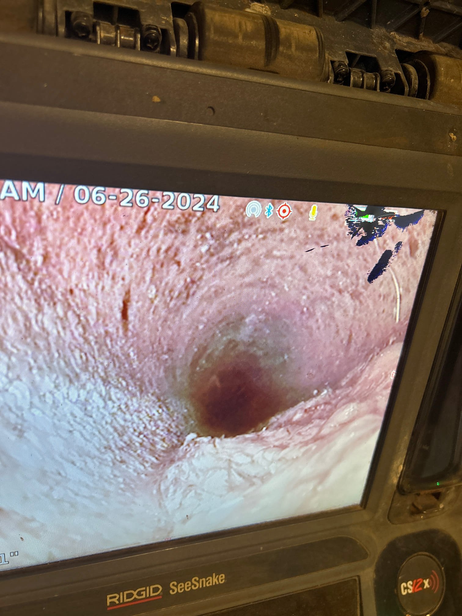 Clean, clear water flows from a home faucet, symbolizing whole-home filtration benefits over typical city water; a nearby wrench and mop subtly suggest residential flood remediation troubleshooting, highlighting the system's role in preventing water damage and ensuring pure water throughout the house.