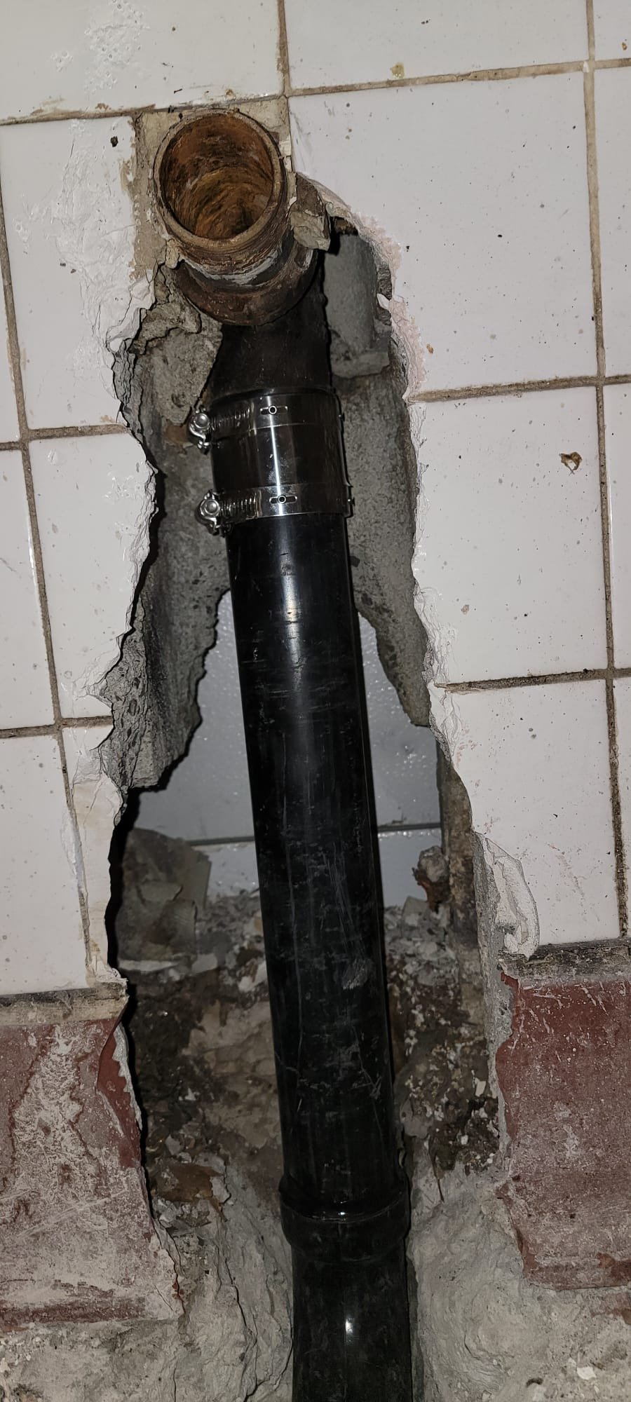 Clean, clear well water flowing into a pristine glass; a dry, finished basement with a fresh, inviting ceiling; illustrating the benefits of effective well water treatment and moisture control.