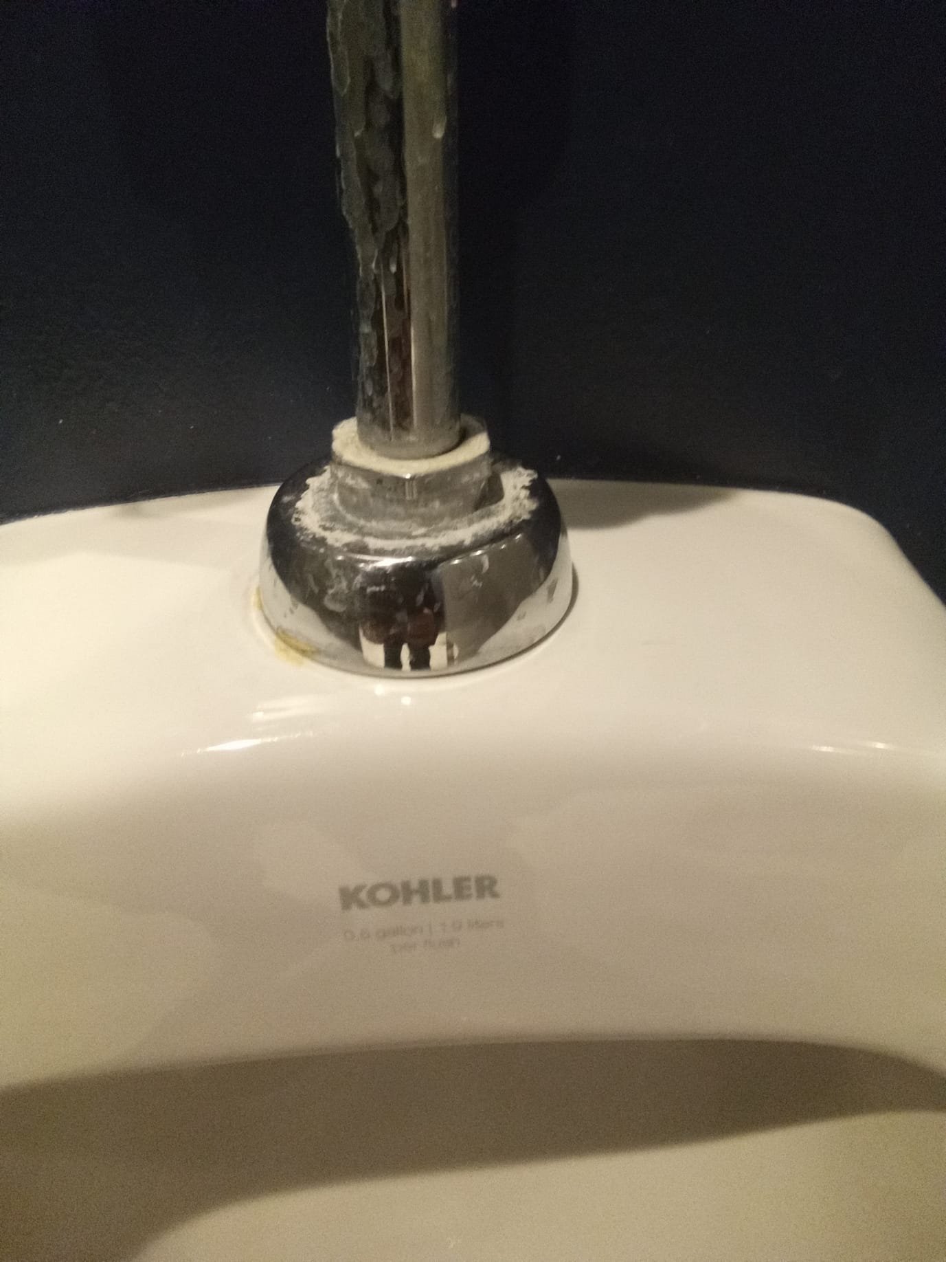 Clean, bright commercial bathroom sink sparkling after mold cleanup. Baking soda box subtly visible. Suggests affordable, effective solution. Request a commercial bathroom mold cleanup estimate today!