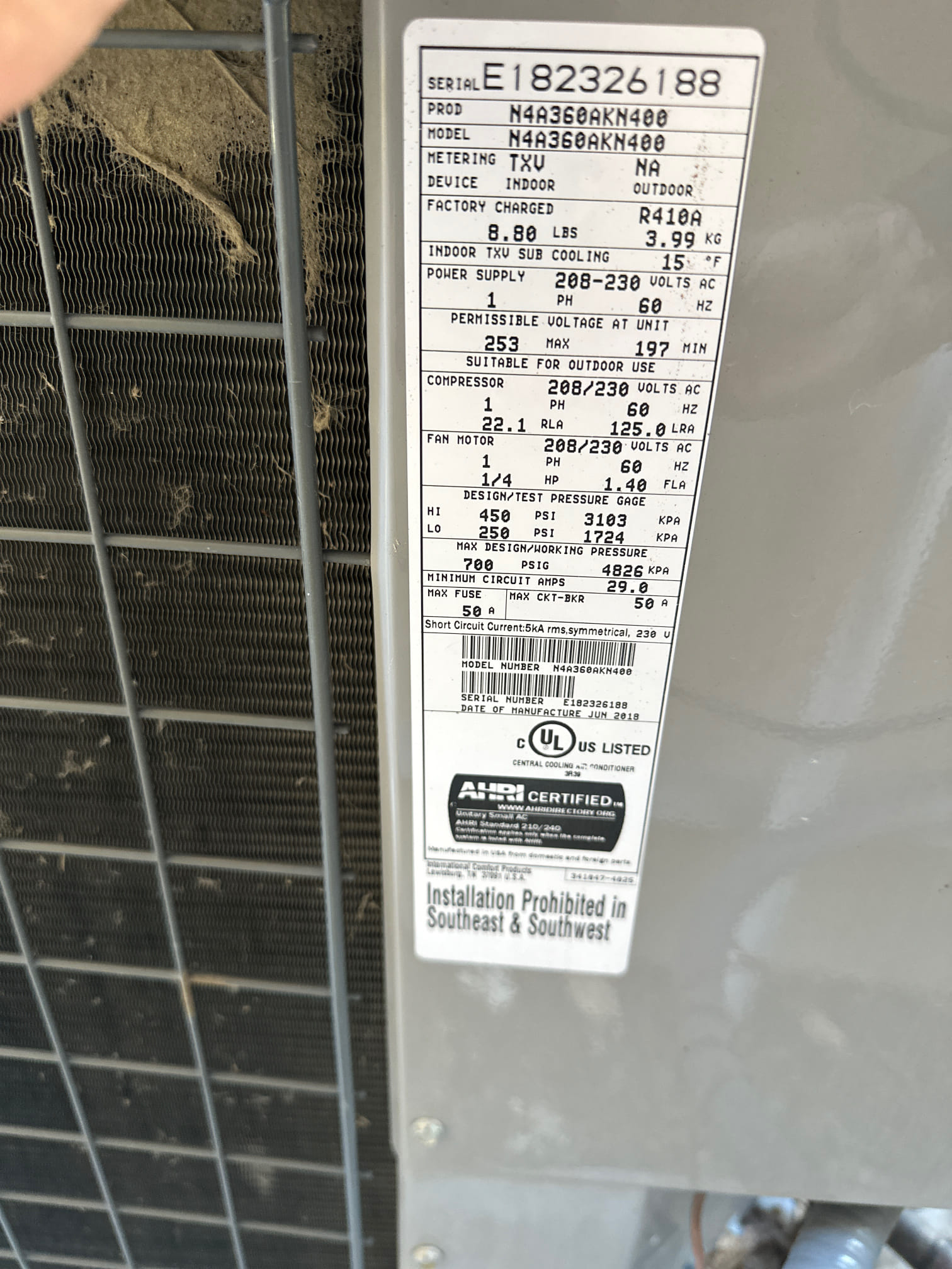 Close-up of a refrigerant can being connected to a car's AC system, symbolizing efficient cooling. The image evokes associations with powerful gas-powered AC and reliable Bryant 3-ton AC units, suggesting dependable performance and relief from heat. Focus is on the visual representation of cool air flowing, highlighting the benefit of a comfortable car ride.