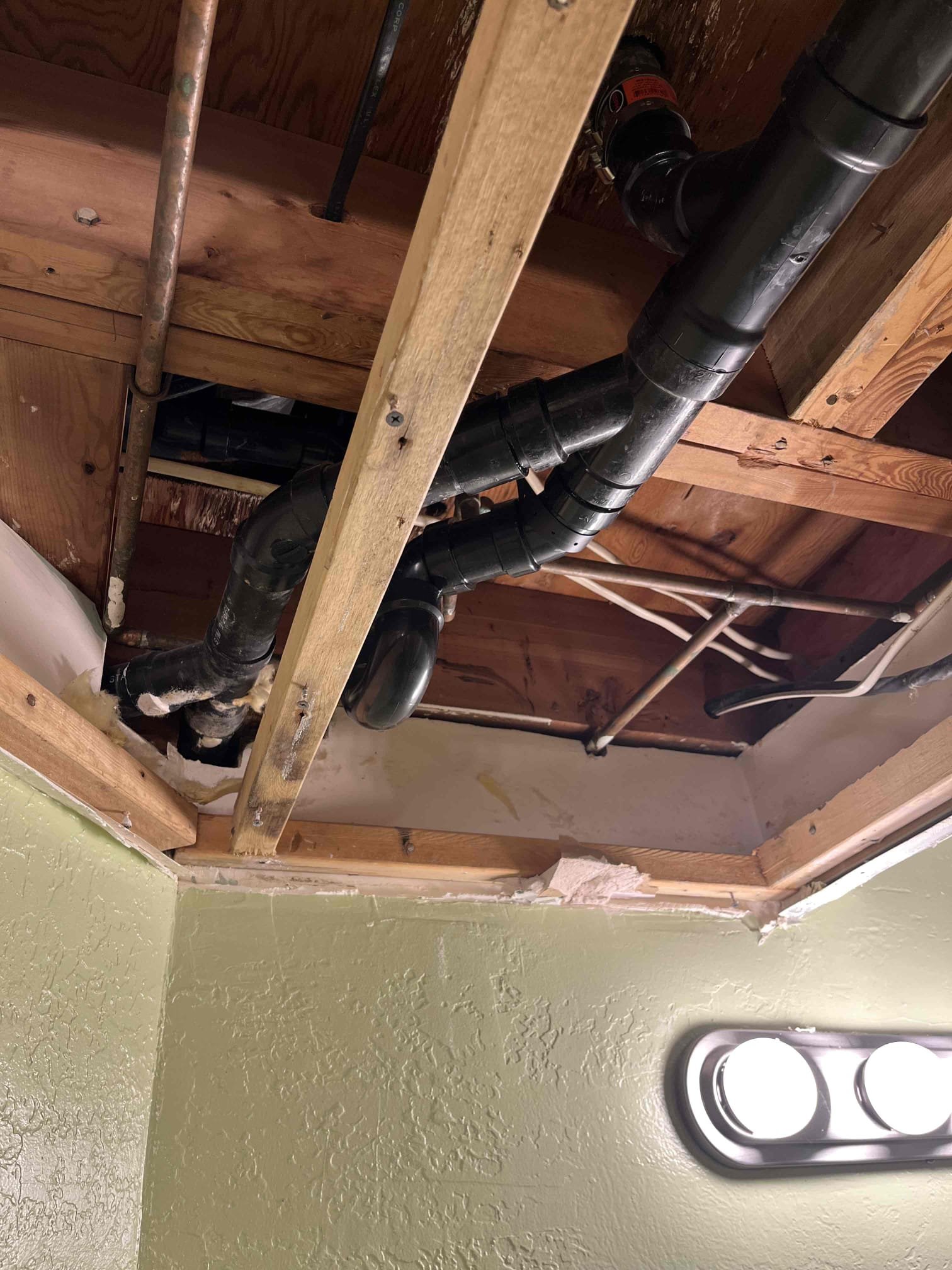 A clean, modern home interior with visible, neatly installed copper pipes and a new, efficient furnace. The image highlights the peace of mind that comes with expert residential plumbing and heating repairs, showcasing leak-free connections and a warm, comfortable living space.