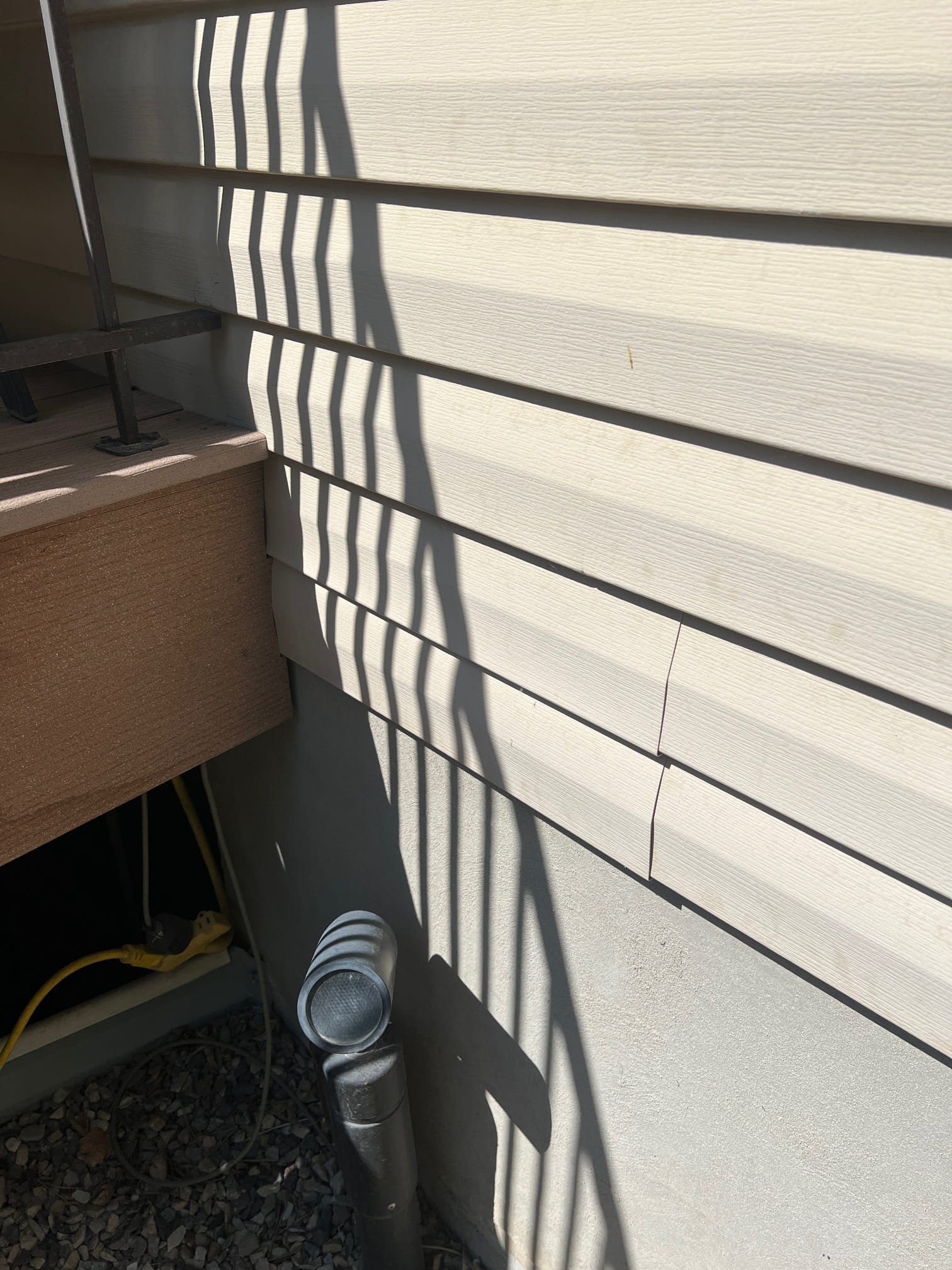 A plumber installs a compact, wall-mounted tankless water heater, highlighting its space-saving design. Clean, modern pipes emphasize efficiency and on-demand hot water. This showcases the benefits promoted by tankless water heater dealers.