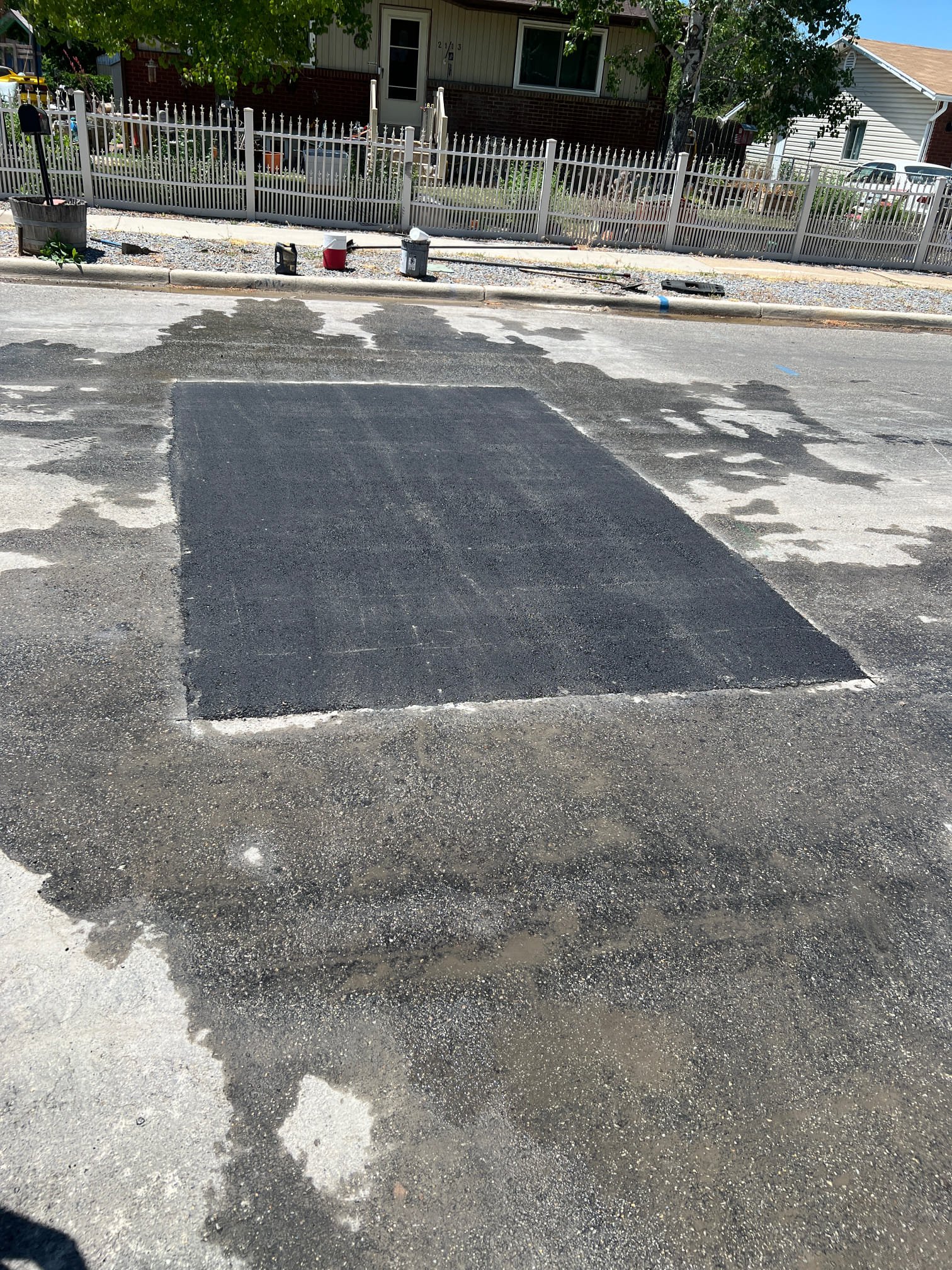 Commercial building interior, post-fire, partially cleaned. Soot-covered areas contrast with sections revealing restored surfaces. Highlights include exposed, clean structural beams and advanced air filtration equipment, demonstrating effective cleanup and hinting at transparent pricing for comprehensive fire damage restoration.