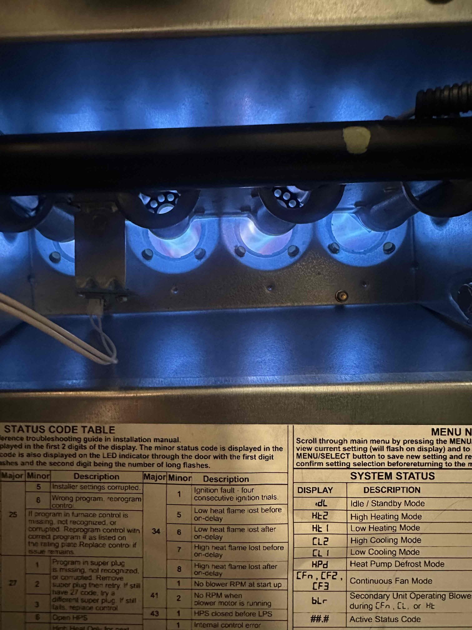 A newly installed, gleaming heating furnace ensures efficient home comfort. Visible ductwork promises even heat distribution, highlighting the benefits of a modern heating and air system installation.