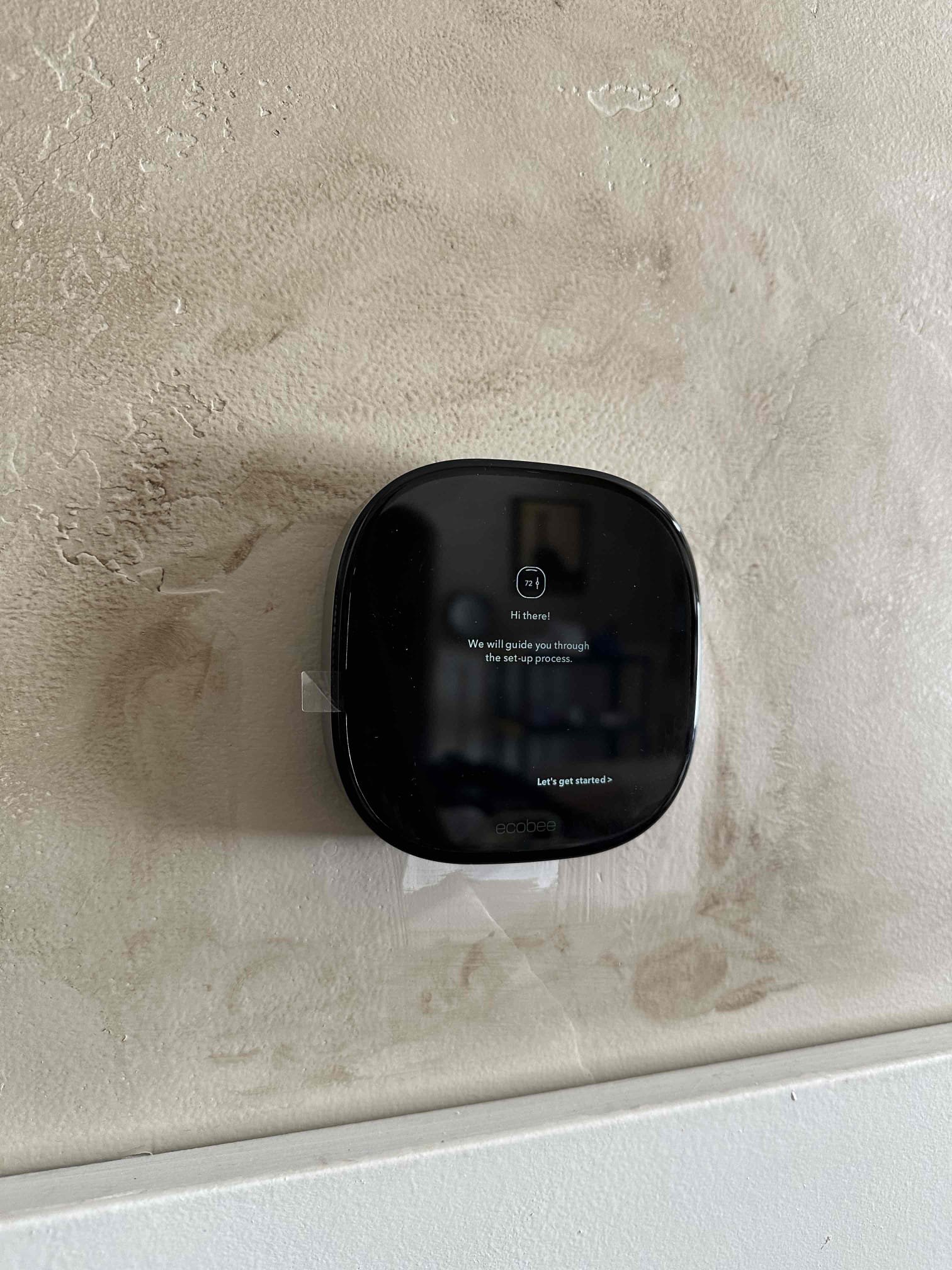 Screenshot of a user-friendly wifi thermostat app interface, showcasing easy scheduling and remote control. The app displays a clear temperature setting, energy savings statistics, and a prominent Honeywell Home logo, emphasizing the convenience and programmability of the thermostat for efficient home or shop temperature management.