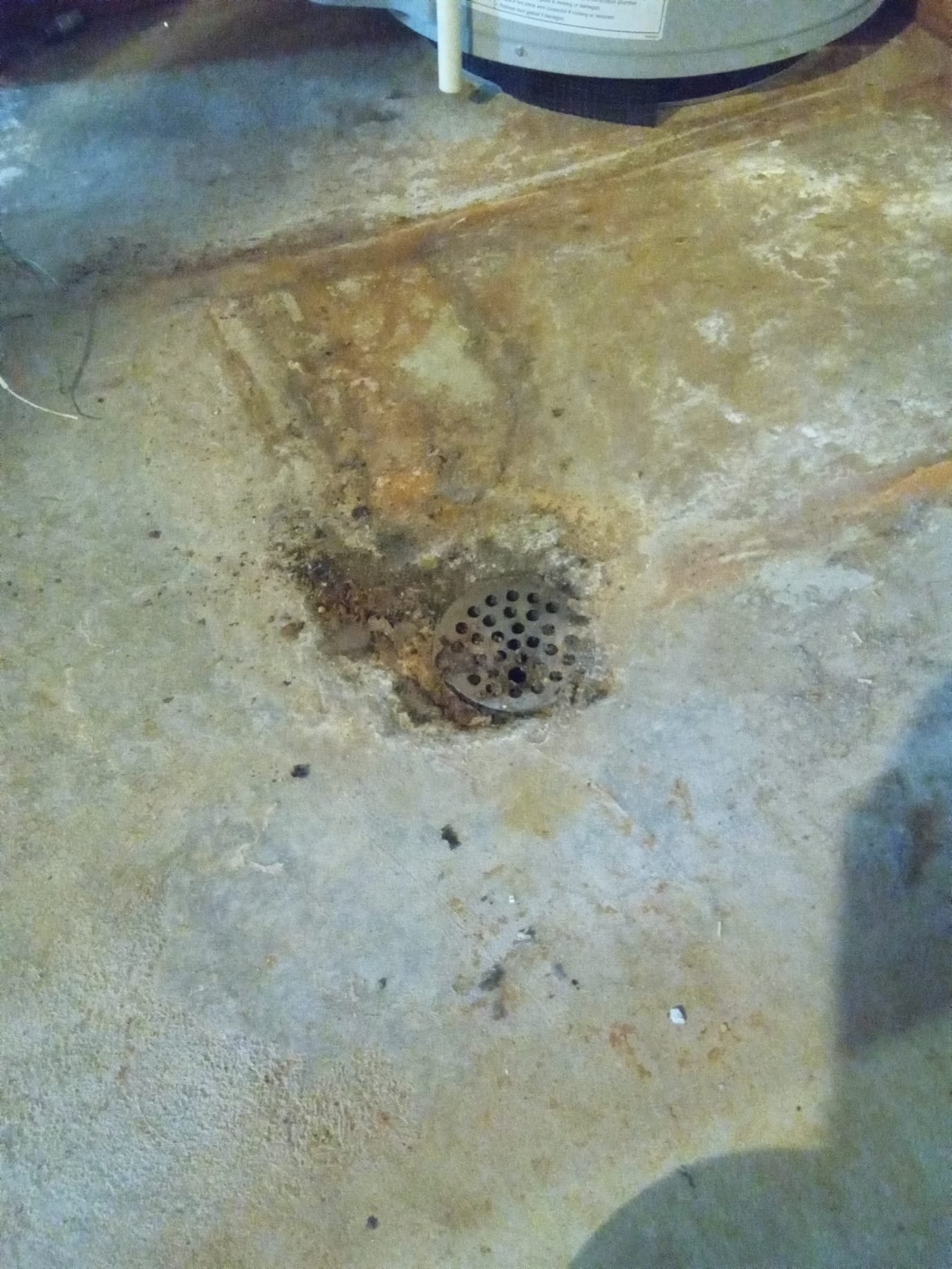 Image of a sparkling clean commercial kitchen after fire damage repair, highlighting a grease trap being professionally cleaned. The scene emphasizes the benefits of fire cleaning maintenance, preventing future hazards and ensuring a safe, hygienic environment for cooking and food preparation.