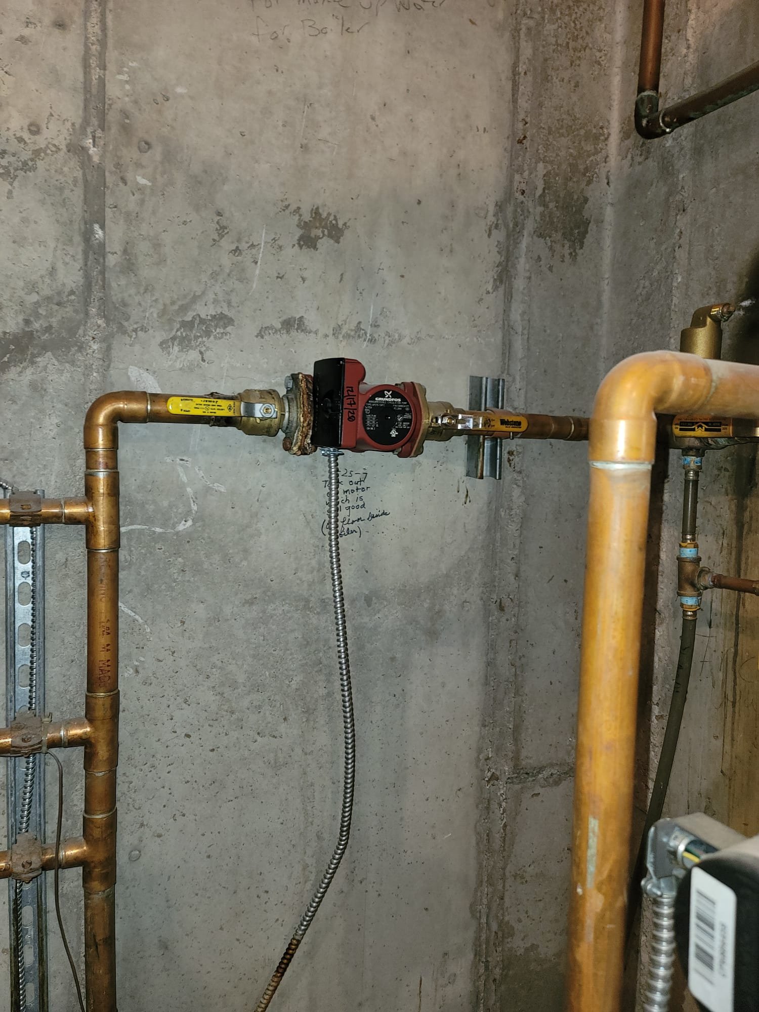 Image shows a pristine, uncluttered sink with gleaming pipes below, symbolizing a well-maintained plumbing system. In the background, a modern, efficient boiler operates silently, promising reliable heating and hot water. This reflects the peace of mind gained from regular boiler inspections and maintenance, preventing issues like noisy boilers and clogged sinks.