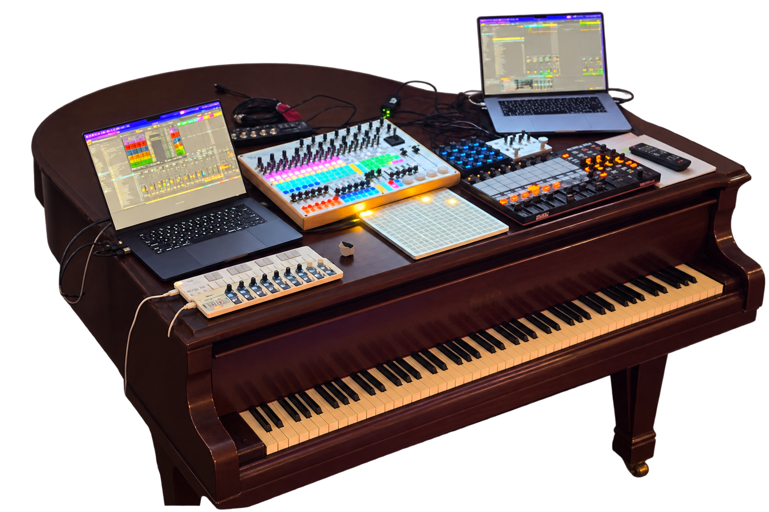 Grand piano with laptops and electronic performance controllers