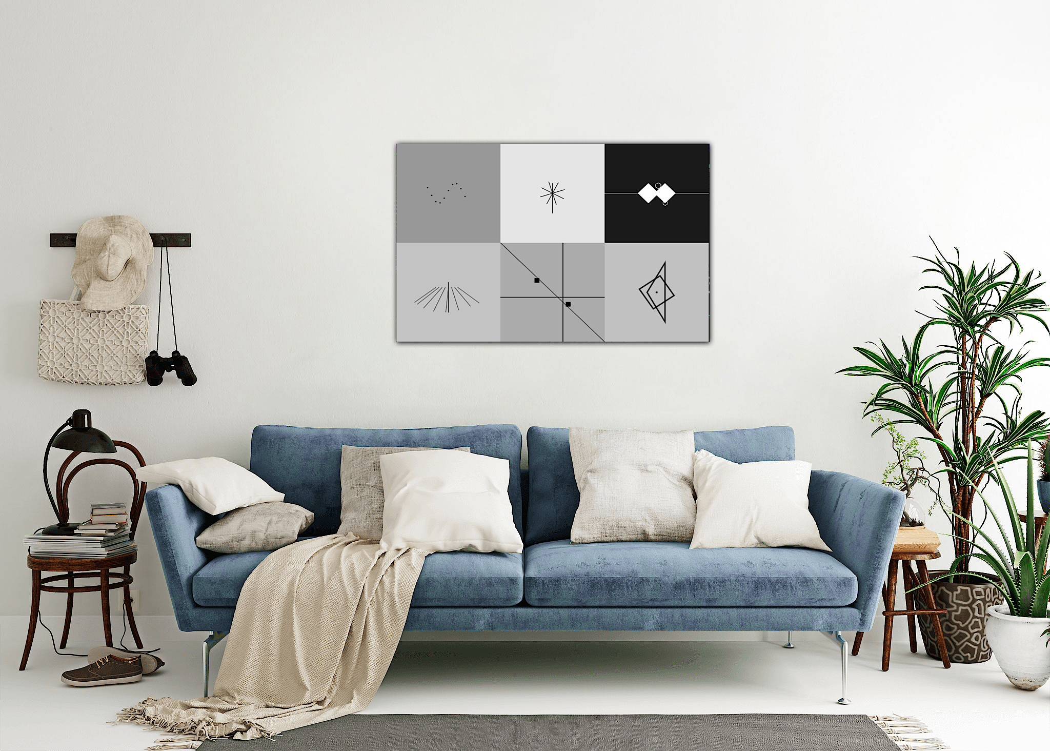 Geometric wall art above a blue sofa