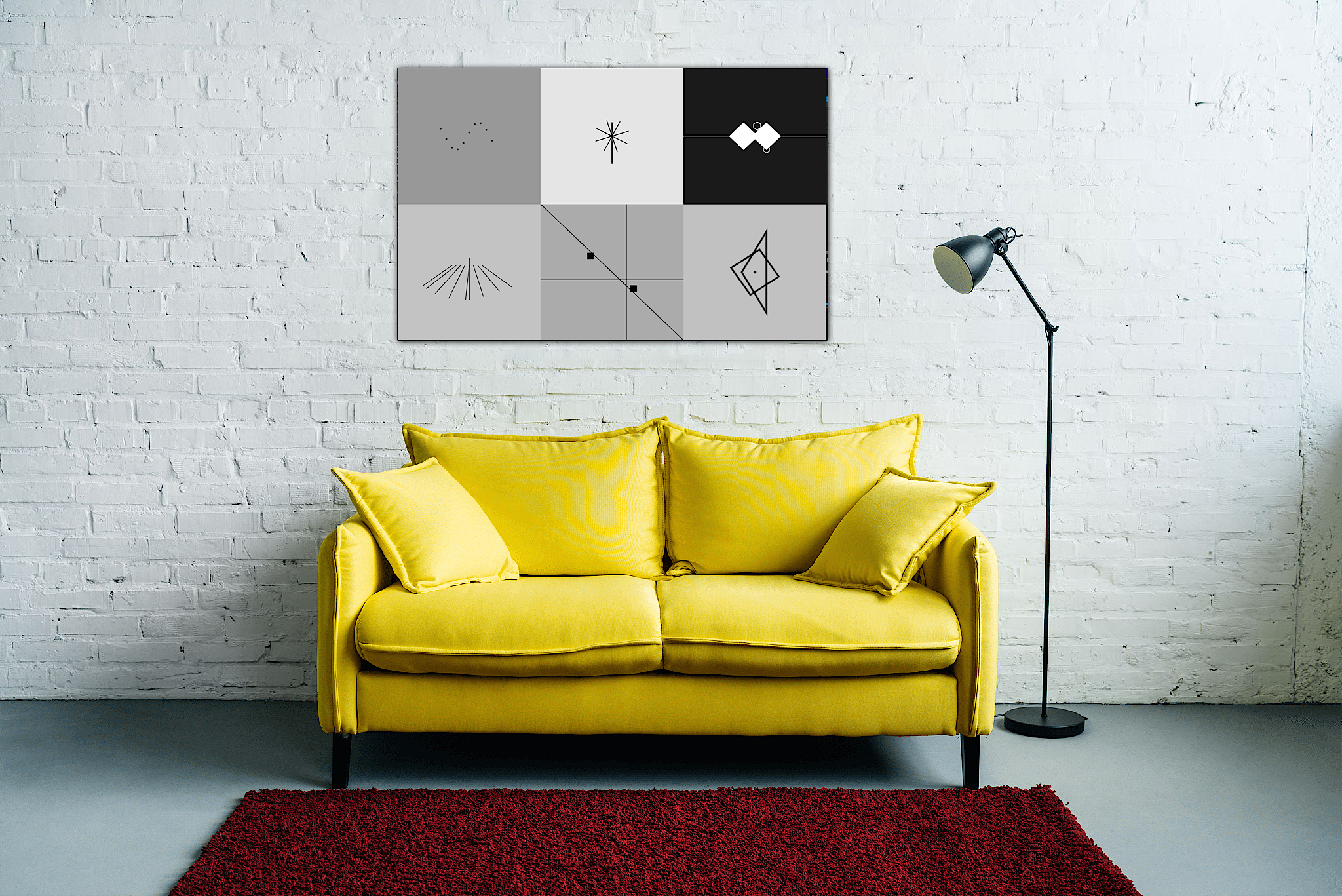Geometric wall art above a yellow sofa