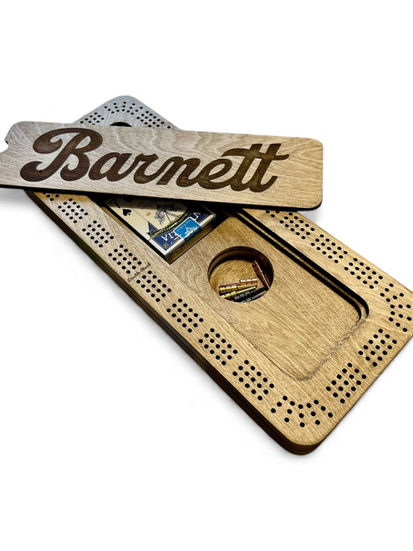 Custom crib board with the name Barnett engraved on the top.