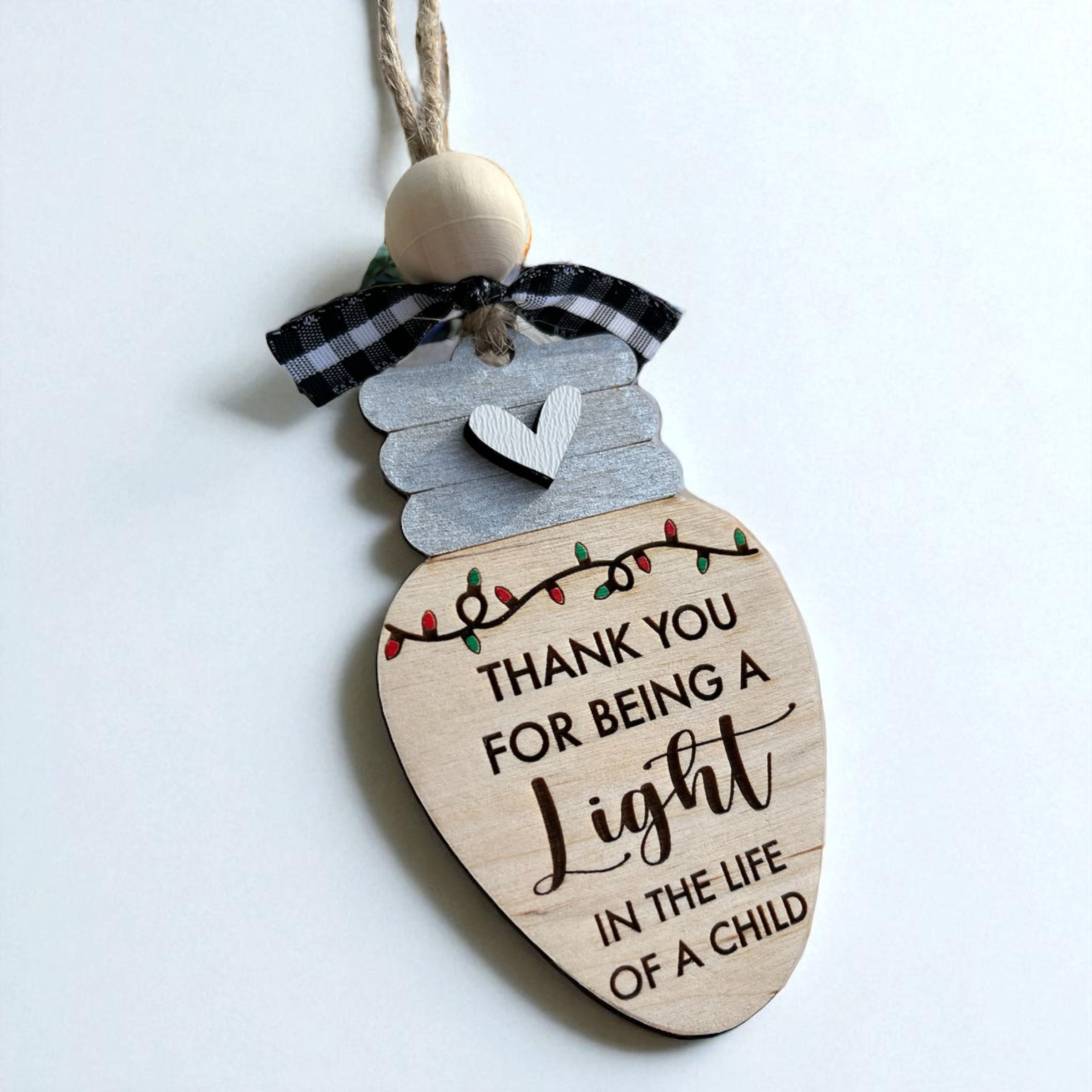 Teacher Christmas ornament engraved with thank you for being a light in the life of a child