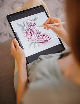 Woman illustrating on ipad with apple pencil