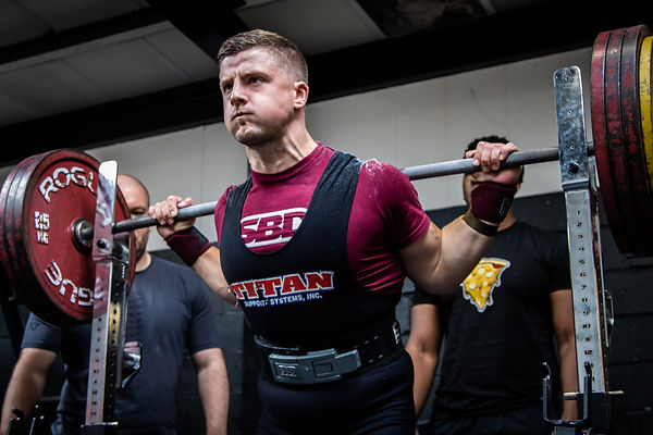 a strength coach weightlifting