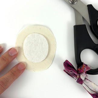 Cutting muslin cover for backing of fussy cut brooch