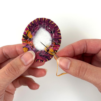 Hand stitching embroidery around fussy cut brooch edge