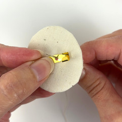 Hand sewing pin back to brooch backing
