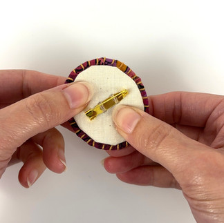 Gluing backing to brooch