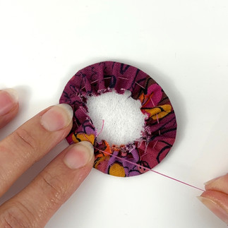Pull thread to gather around fussy cut brooch