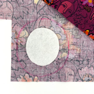 Draw around brooch base on background fabric